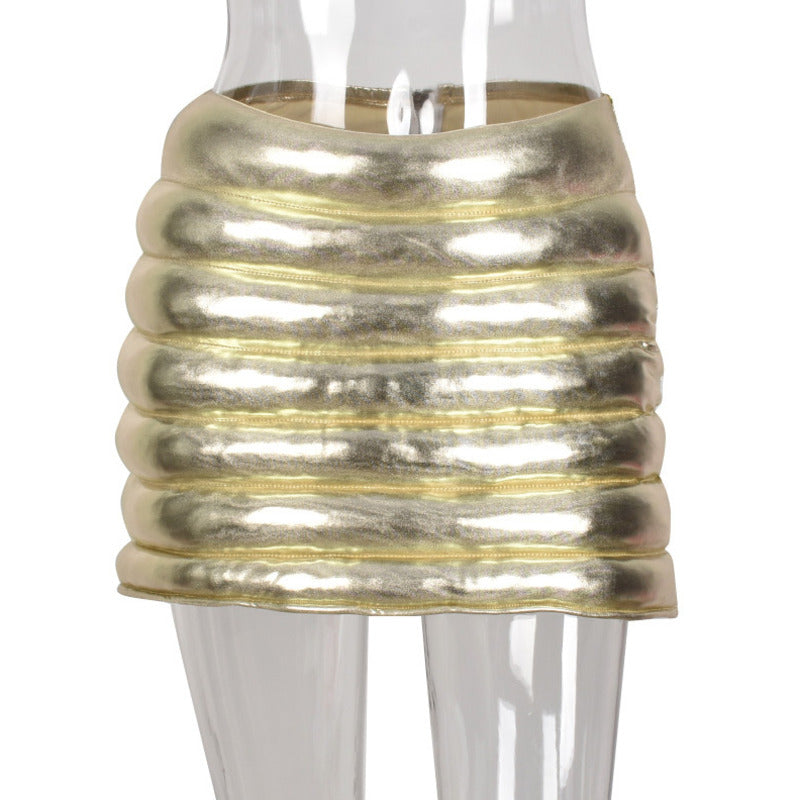 Champagne Women's Puffer Skirt featuring a metallic shiny finish, warm quilted design, and zipper closure, perfect for stylish outings.