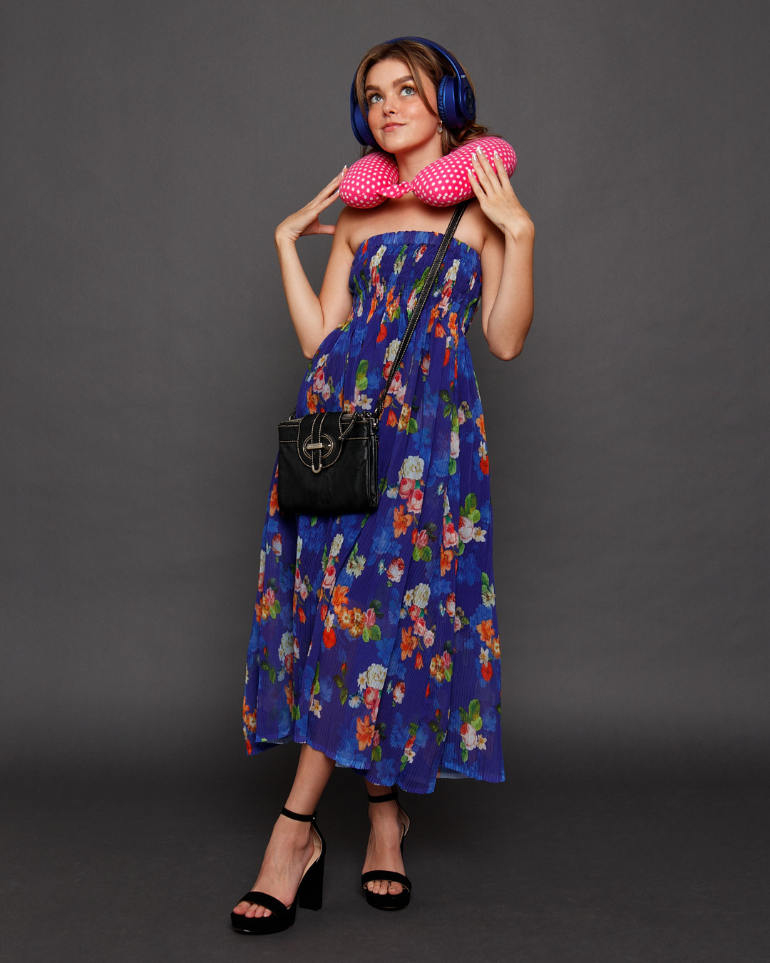 A stylish floral spring off the shoulder dress in midnight blue, featuring a vibrant floral print and an adjustable waistband.