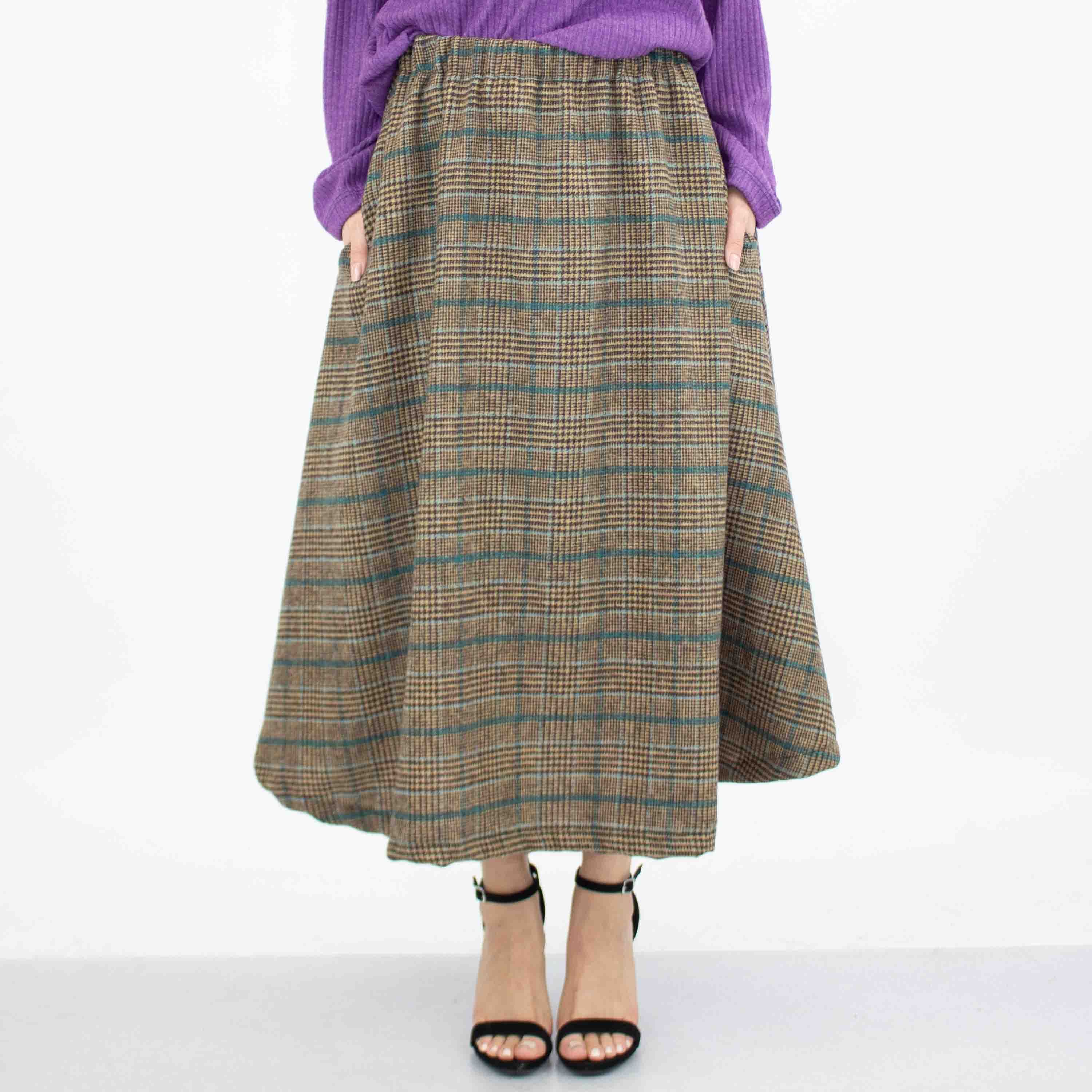 A stylish blue plaid flare midi skirt featuring an elastic waist and side pockets, perfect for casual wear.