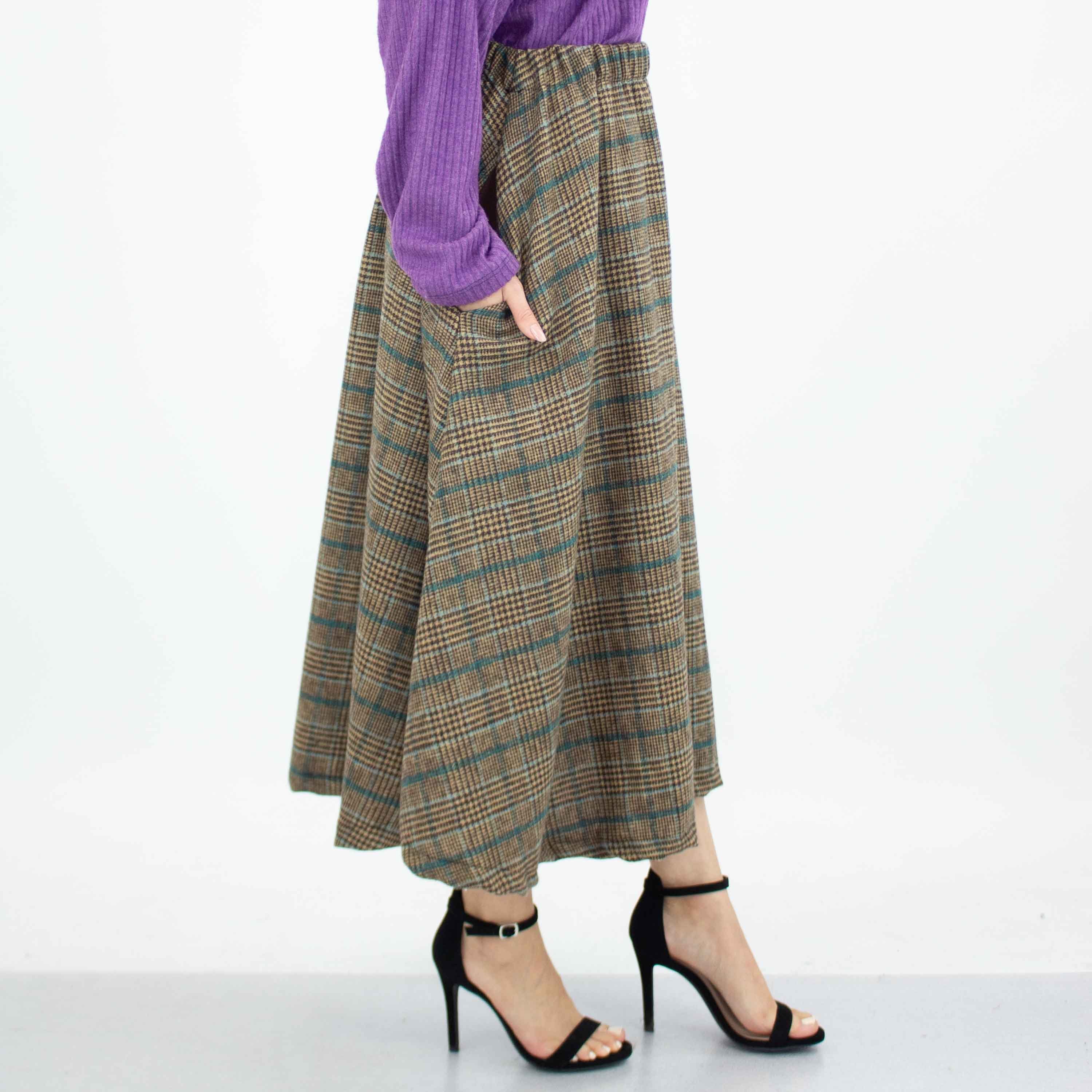 A stylish blue plaid flare midi skirt featuring an elastic waist and side pockets, perfect for casual wear.