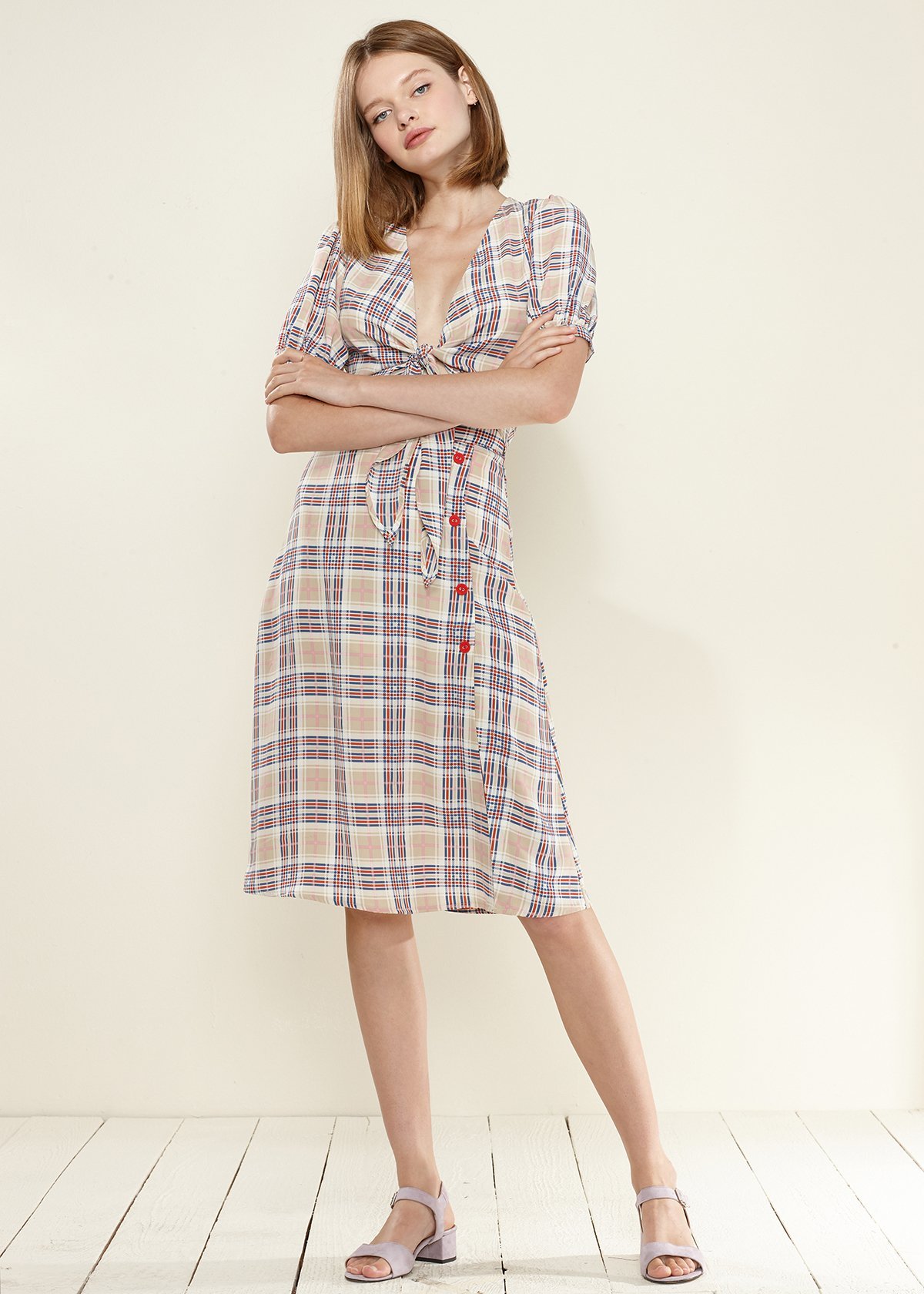 A stylish Women's Multi Check Button Down Slit Skirt in Multiplaid, featuring a unique multi-check pattern and elegant slit design.