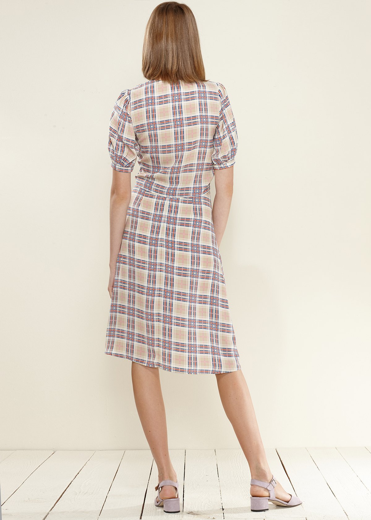 A stylish Women's Multi Check Button Down Slit Skirt in Multiplaid, featuring a unique multi-check pattern and elegant slit design.