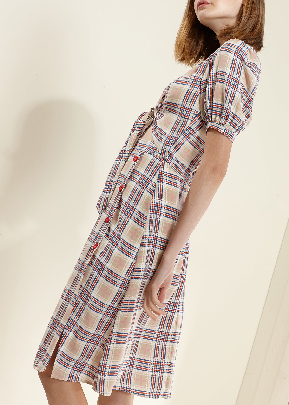 Women's Multi Check Button Down Slit Skirt featuring a stylish check pattern and side slit detail, perfect for various occasions.