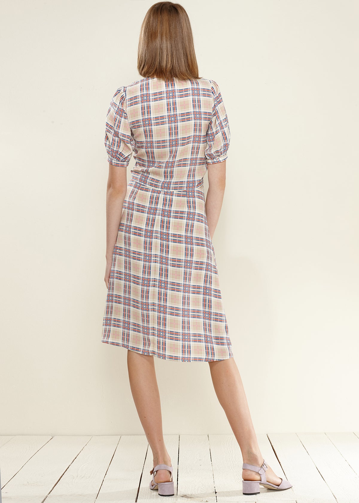 Women's Multi Check Button Down Slit Skirt featuring a stylish check pattern and side slit detail, perfect for various occasions.