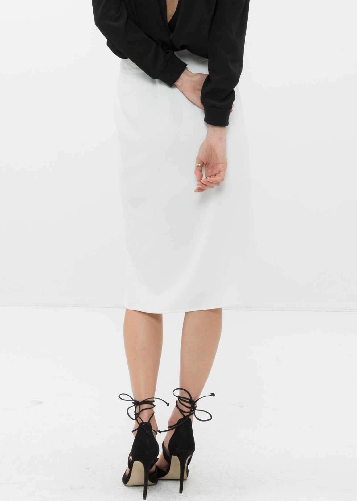 Women's Zip Up Slit Hem Midi Skirt featuring a stylish slit and zip closure, made from soft polyester fabric.