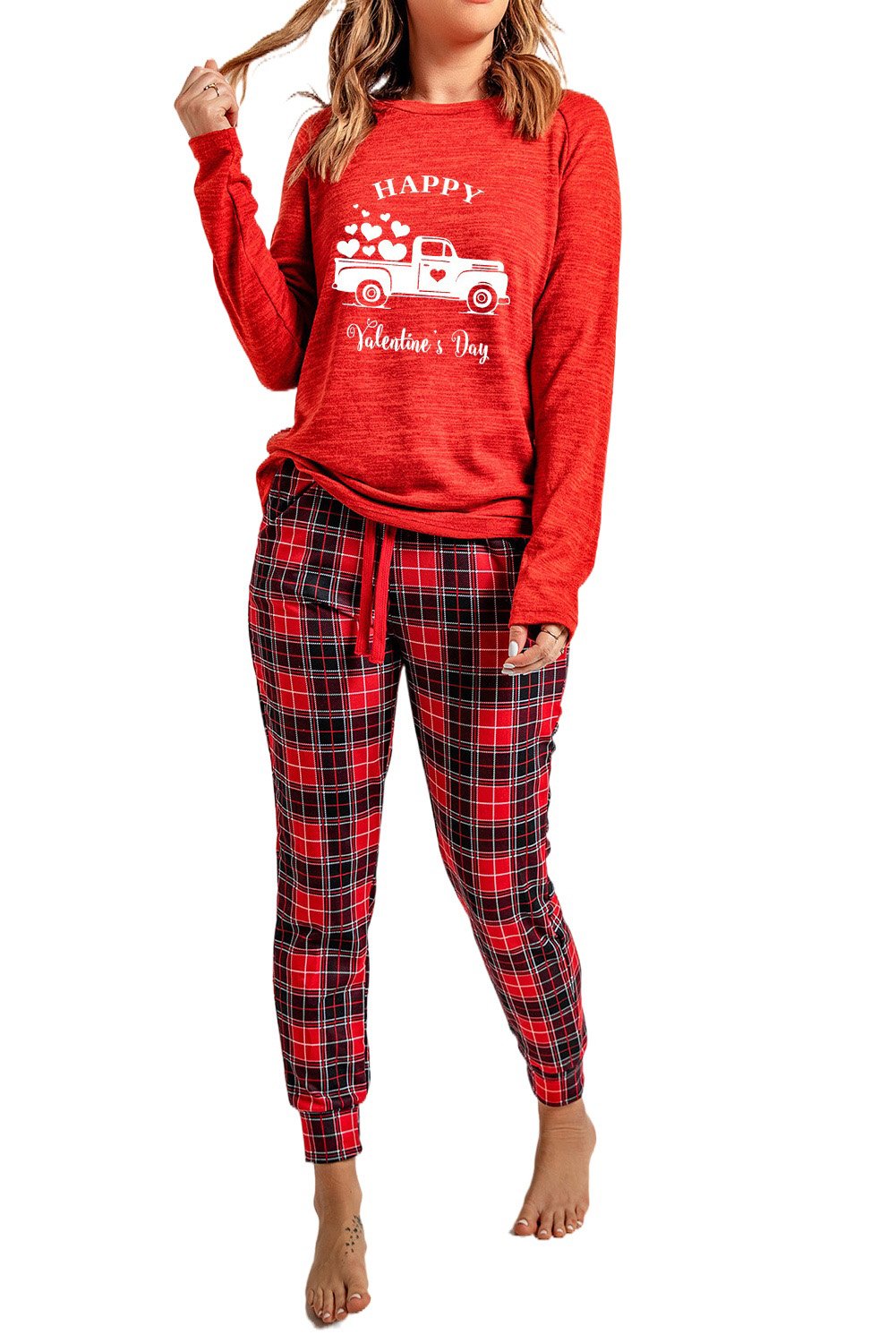 A cozy red lounge set featuring a plaid print, consisting of a full-sleeve top and matching pants, perfect for Valentine's Day and winter lounging.