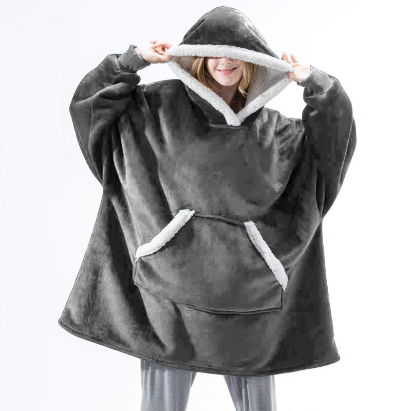 A cozy Winter Warm Fleece Wearable Hooded Blanket in a soft plaid design, featuring an extra-large hood and a roomy pocket, perfect for lounging.