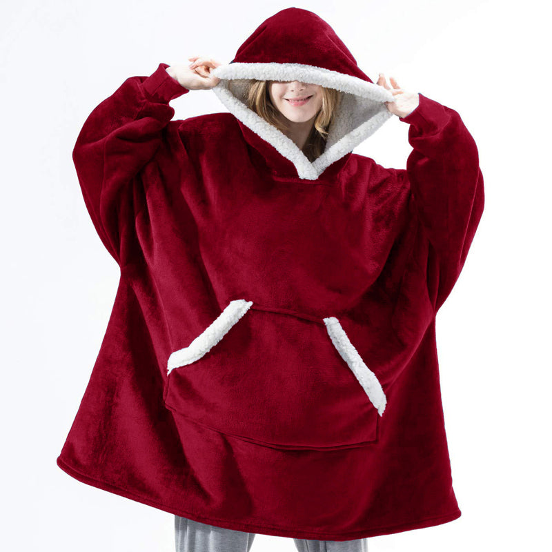 A cozy Winter Warm Fleece Wearable Hooded Blanket in a soft plaid design, featuring an extra-large hood and a roomy pocket, perfect for lounging.