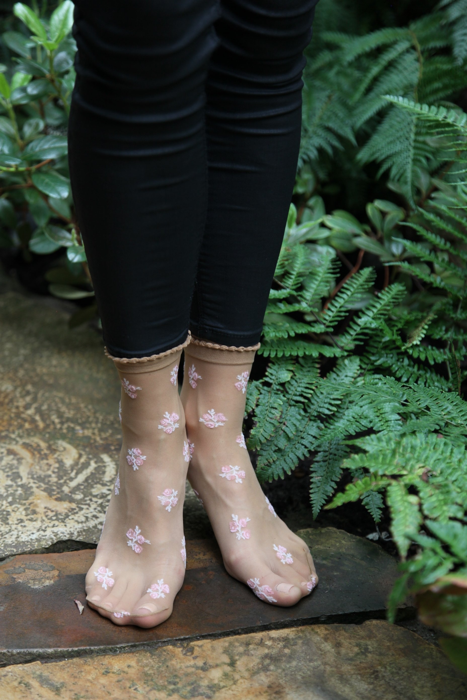 ABELE 20DEN sheer beige socks with floral pattern, elegant and stylish for women.