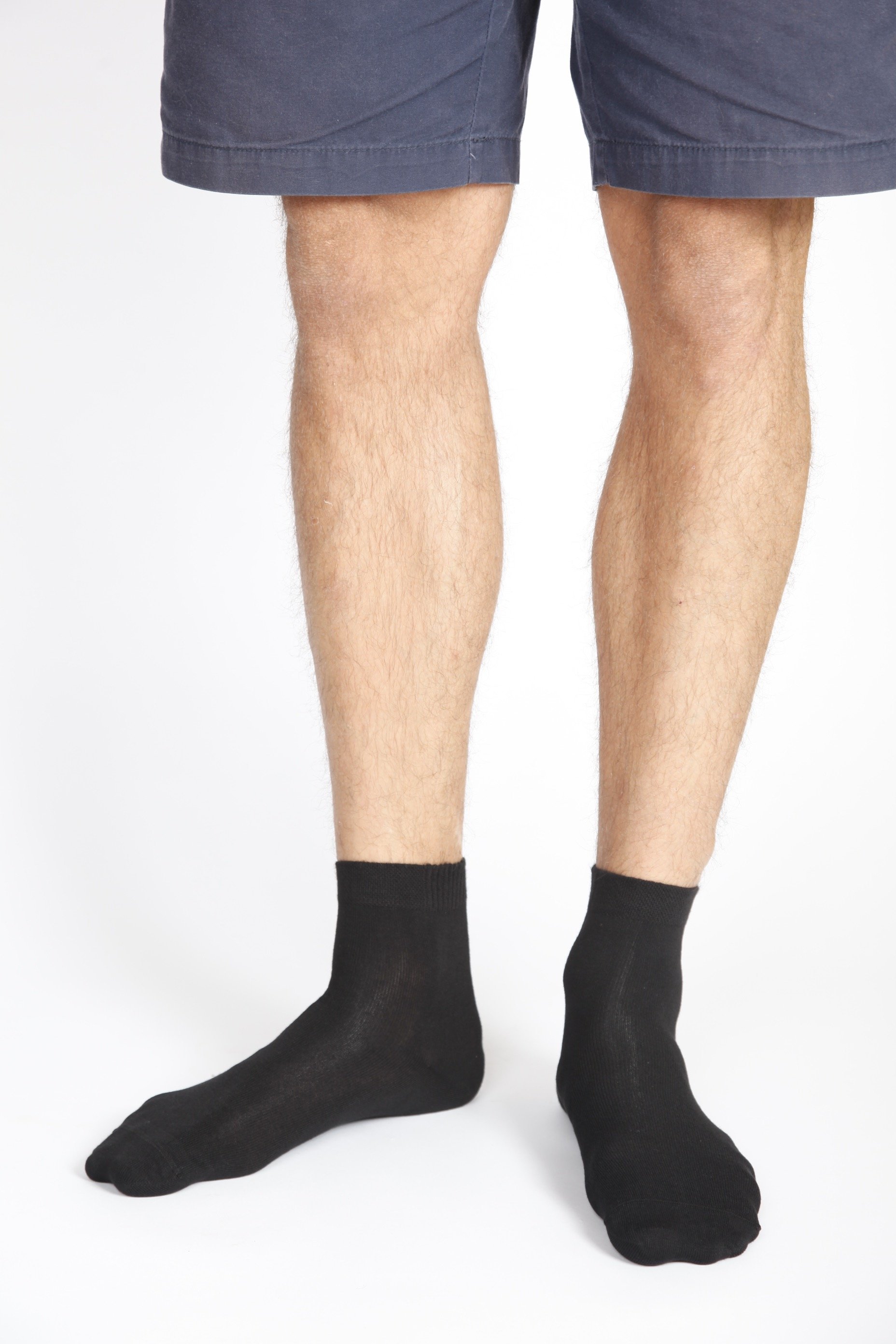 A pair of ALEX black bamboo viscose socks for men, showcasing their low-cut design and soft texture.