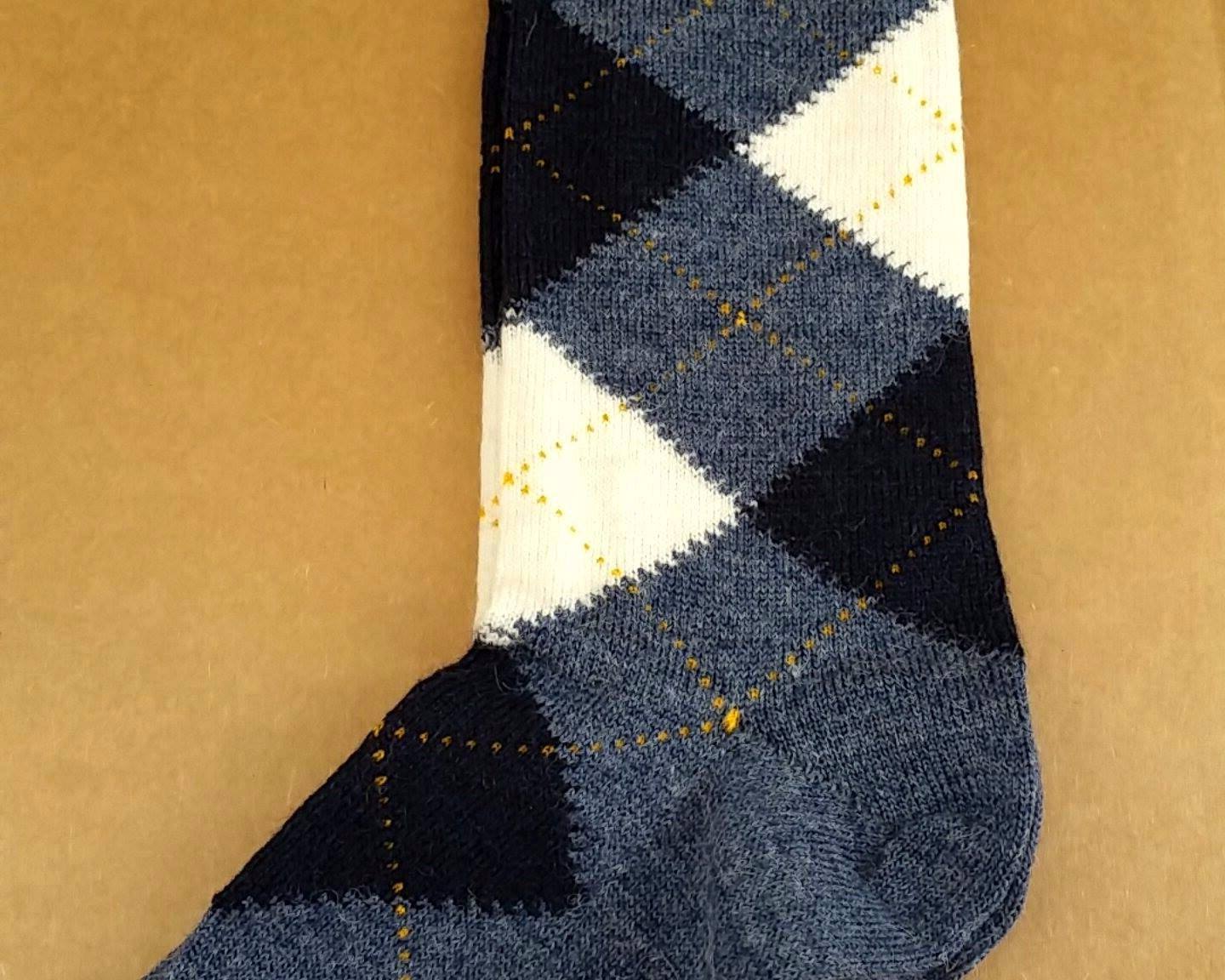 A pair of stylish Alpaca Argyle Socks featuring a classic argyle pattern, made from soft baby alpaca wool, suitable for golfers and casual wear.