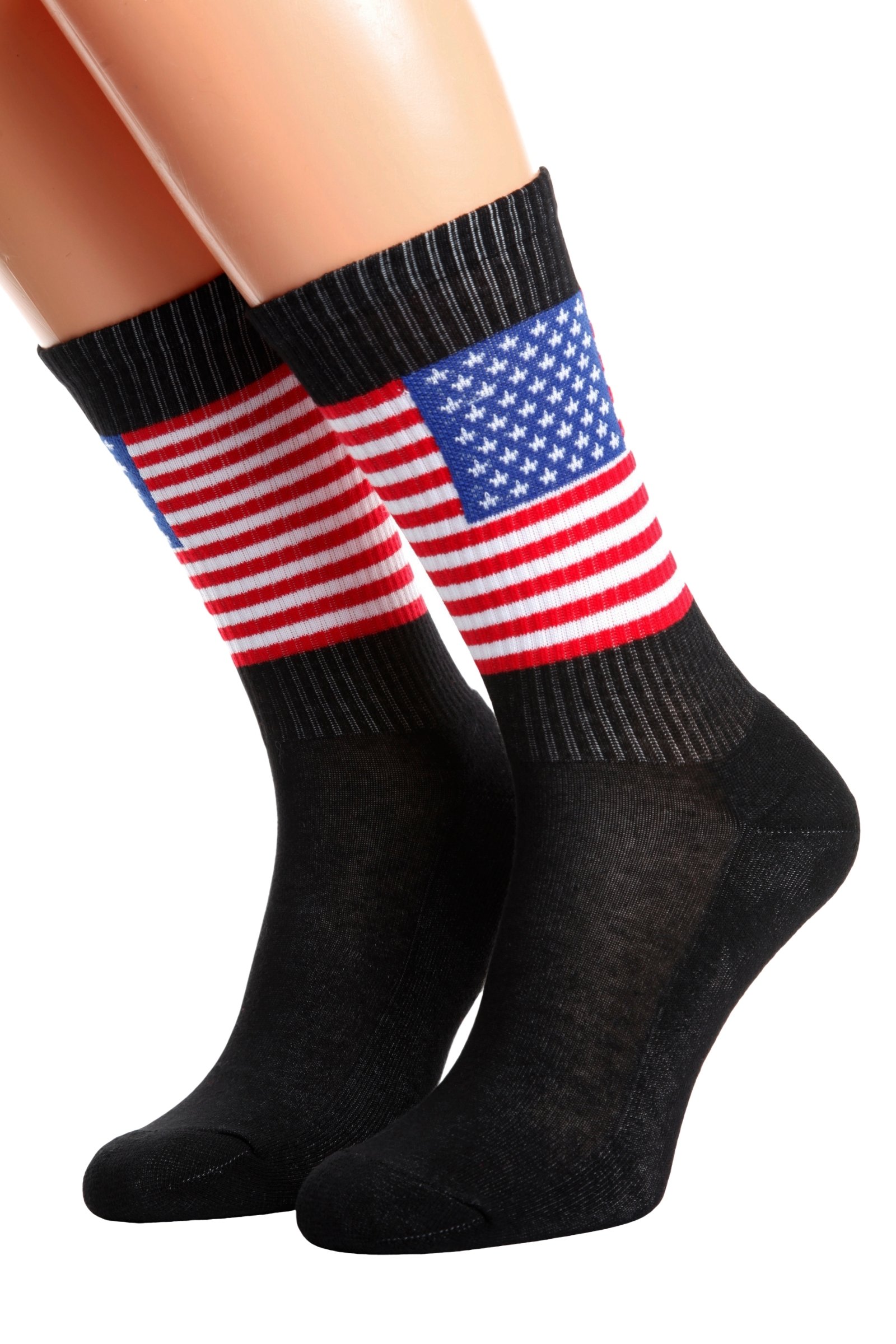 A pair of black cotton socks featuring the American flag design and the word 'AMERICA' on the sole, suitable for men and women.