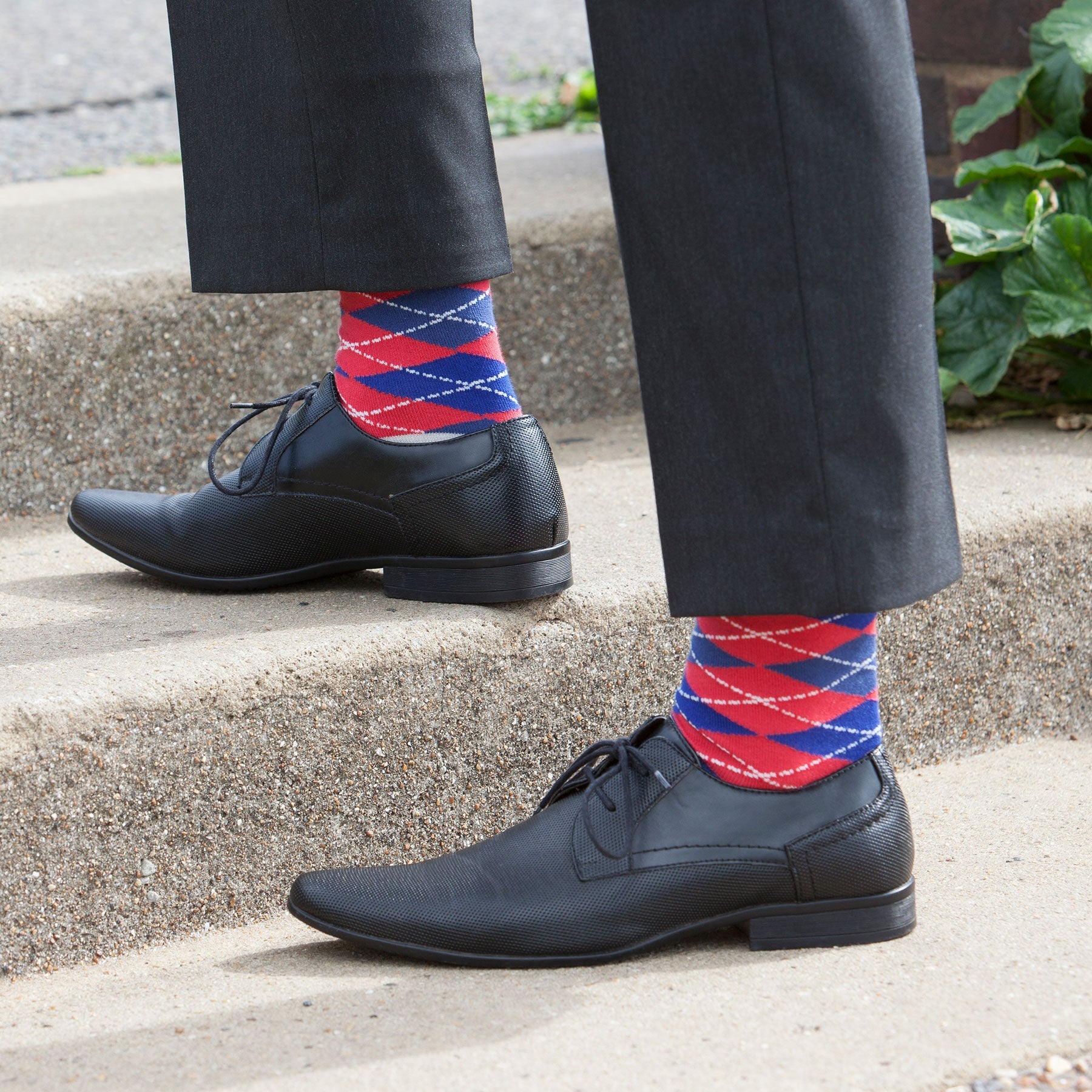 Argyle Men's Socks in Crimson featuring a vibrant red and blue pattern with grey cuff, heel, and toe, made from luxurious Supima cotton.