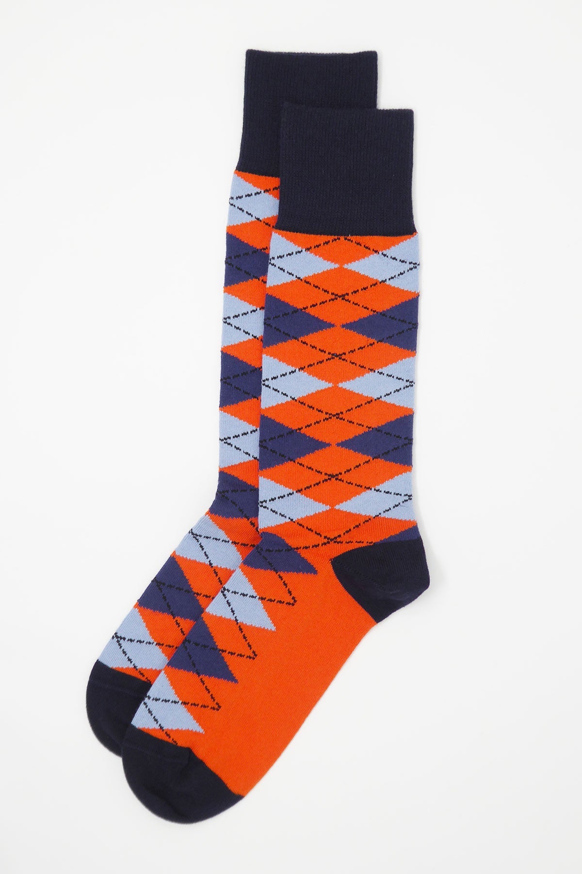 A pair of Argyle men's socks in vibrant orange and blue with navy cuff, heel, and toe, showcasing a stylish and modern design.