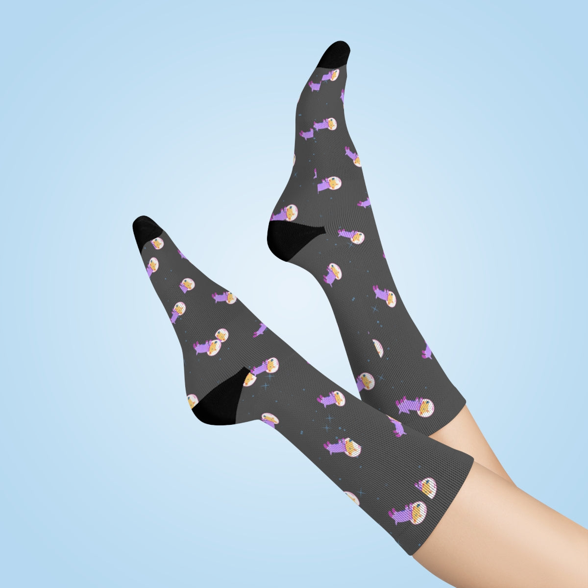 A pair of fun socks featuring a whimsical astronaut dog design, perfect for adding a playful touch to any outfit.