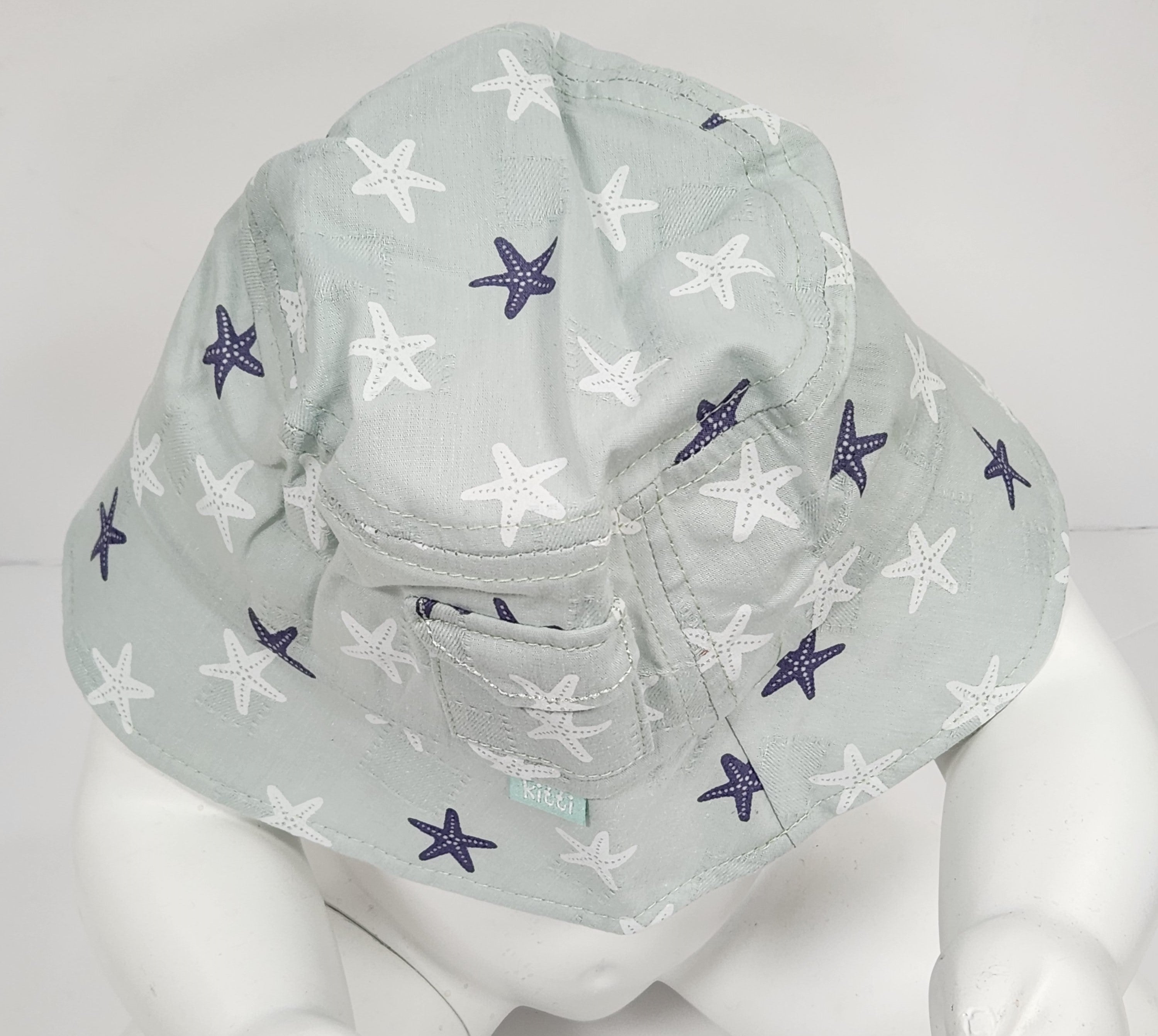 Sierra baby and toddler bucket hat in blue with a star print, made from soft cotton and polyester, designed for ages 1-3 years.