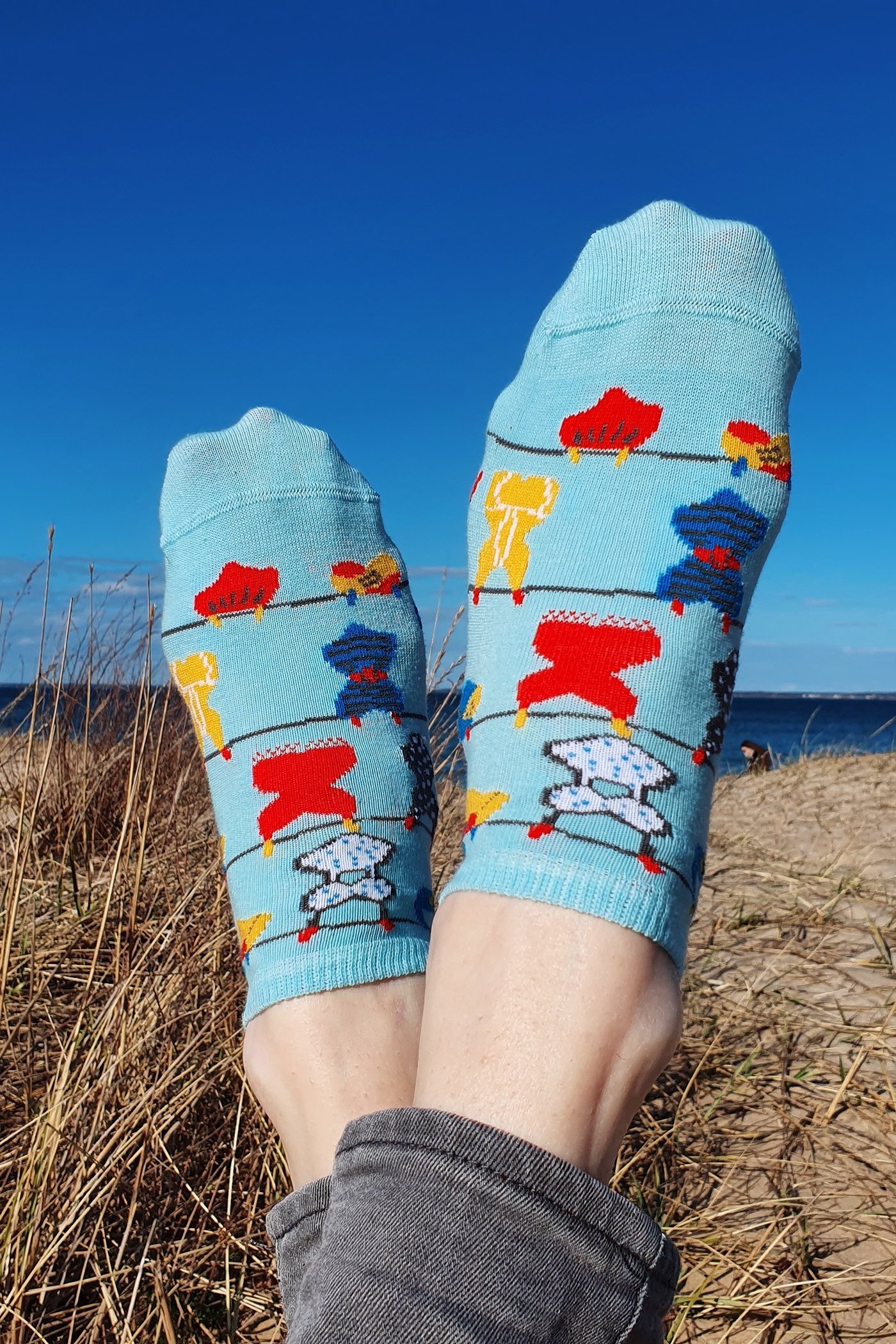 Light blue cotton socks for women with a knitted pattern and motivational writing on the sole, perfect for summer.