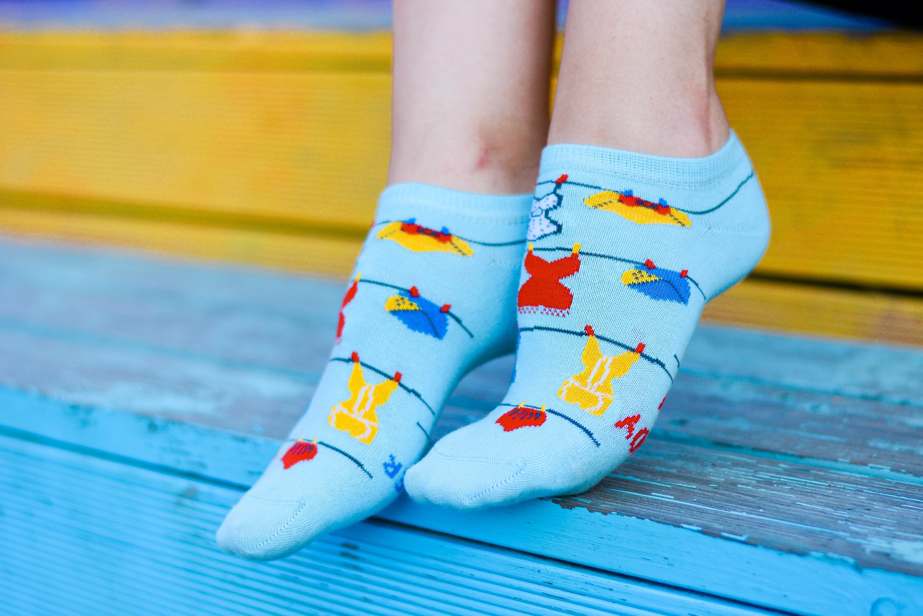 Light blue cotton socks for women with a knitted pattern and motivational writing on the sole, perfect for summer.