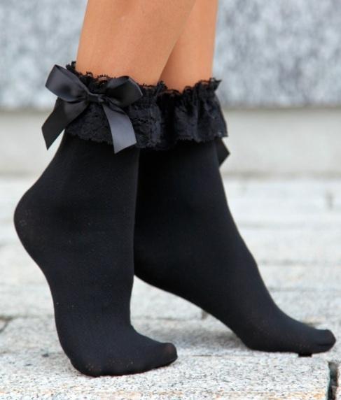 BELLA black socks featuring a wide lace edge and satin bow, showcasing elegance and comfort.