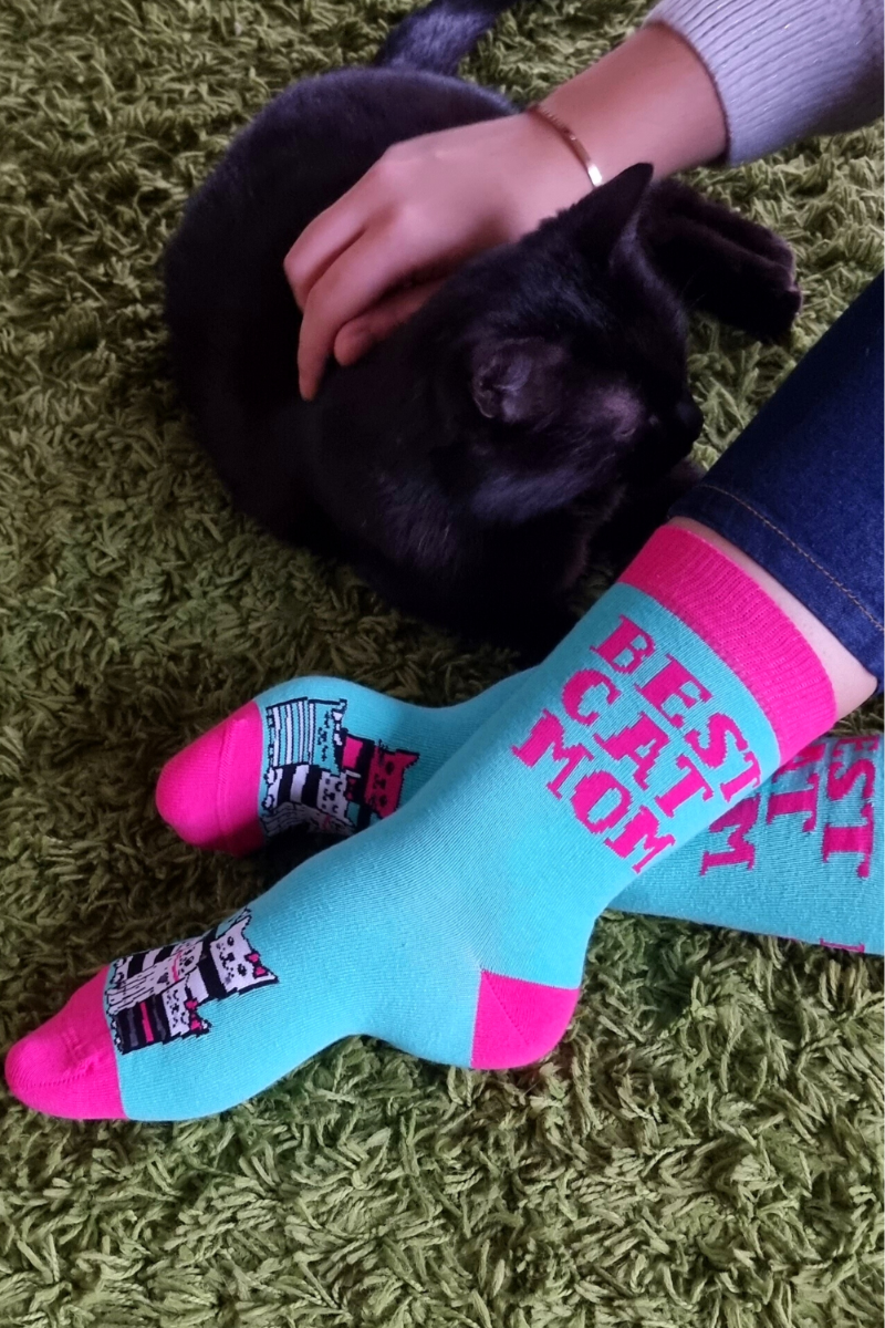 BEST CAT MOM cotton socks featuring colorful kitties and pink lettering on a green background.