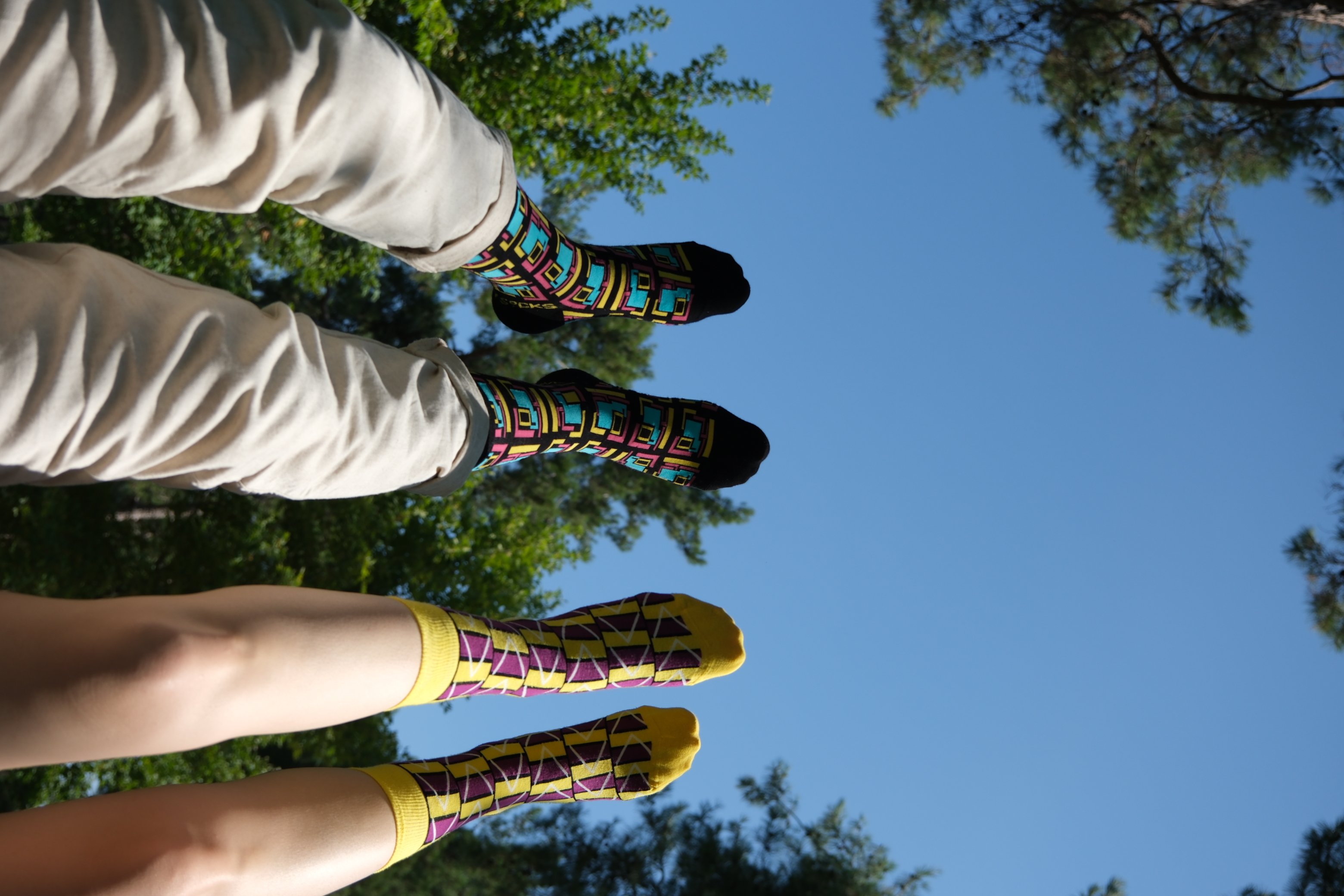 A pair of stylish black geometric unisex socks featuring a modern design, perfect for adding flair to any outfit.