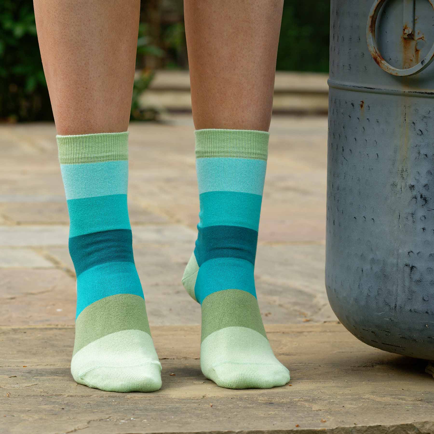 Earth Block Stripe women's socks featuring vibrant green stripes, made from luxurious Supima cotton.