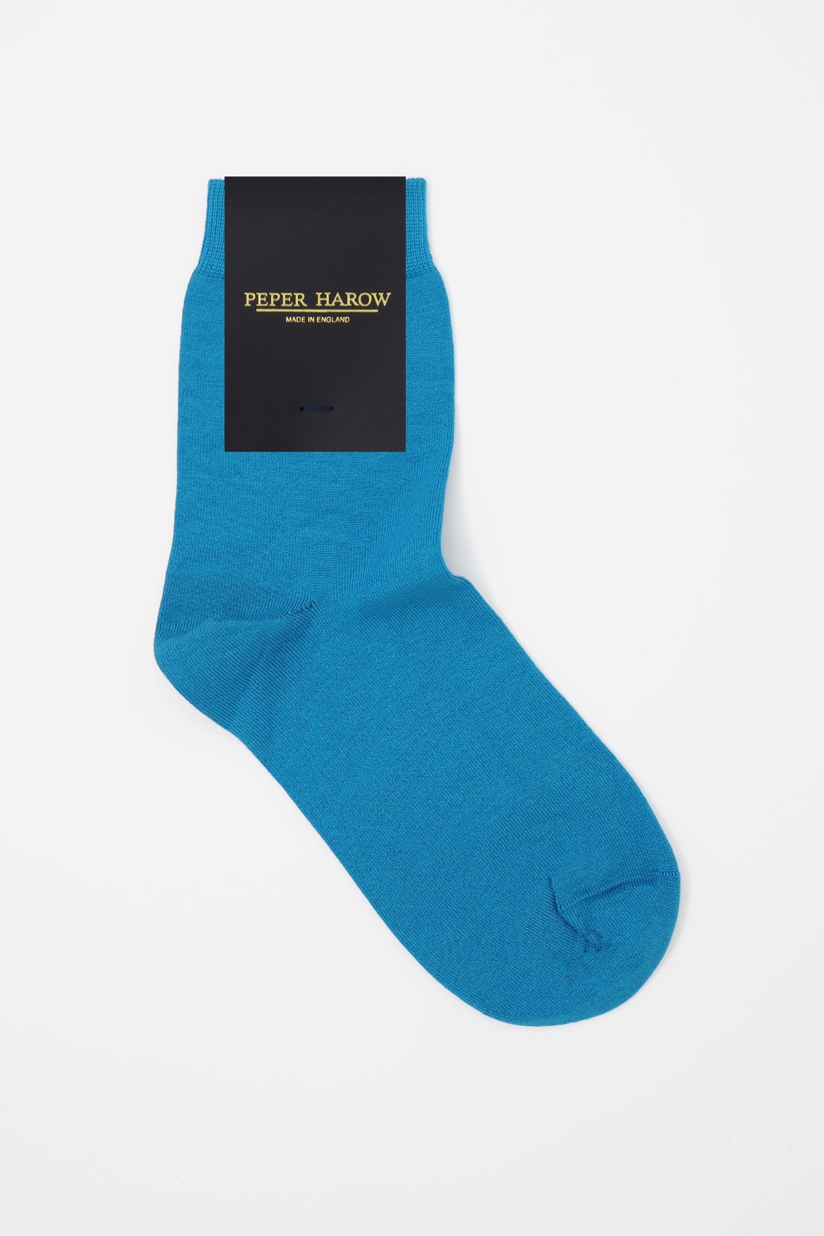 A pair of classic women's socks in vibrant blue, made from luxurious Egyptian cotton, showcasing a seamless toe design.