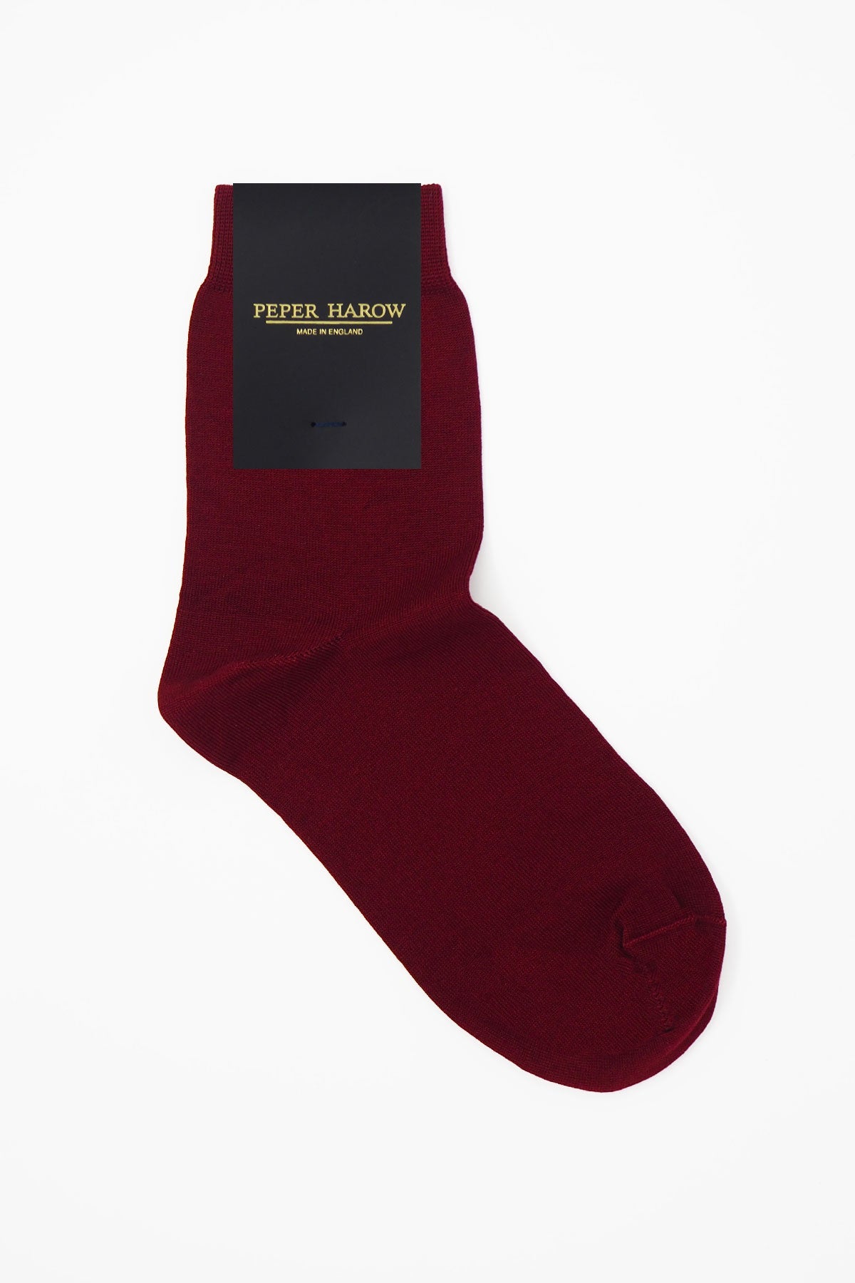 A pair of luxurious burgundy women's socks made from Mercerised Egyptian cotton, featuring a seamless toe design.