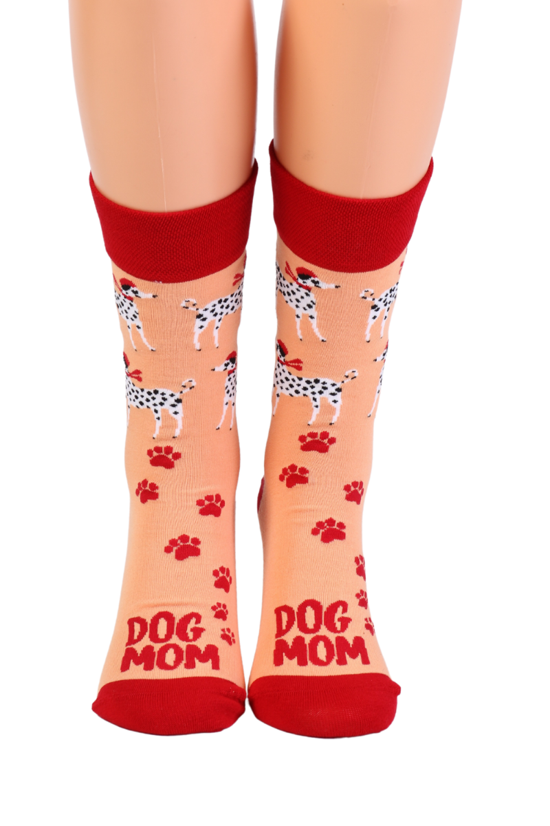 A pair of vibrant orange socks featuring Dalmatians and the text 'DOG MOM', perfect for dog owners.