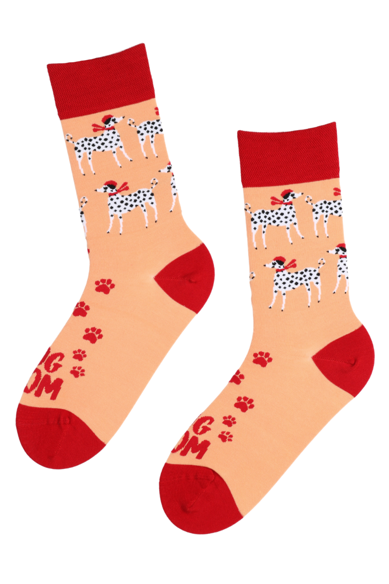 A pair of vibrant orange socks featuring Dalmatians and the text 'DOG MOM', perfect for dog owners.