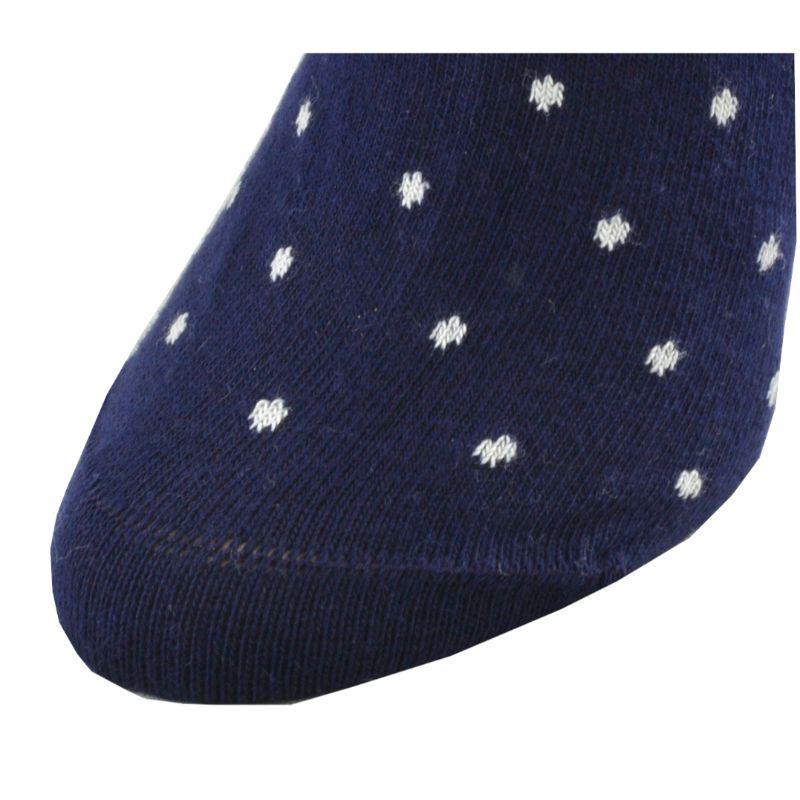 A pair of elegant mid-calf cotton socks featuring a stylish dot pattern, showcasing their soft texture and comfortable cuff design.