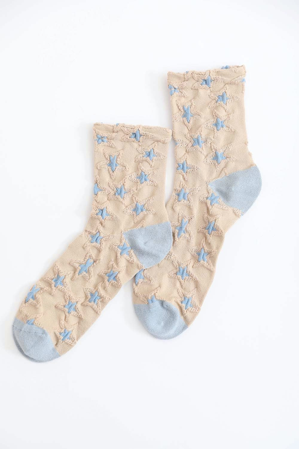 A pair of eco-friendly socks featuring a playful star design, showcasing their soft texture and vibrant colors.