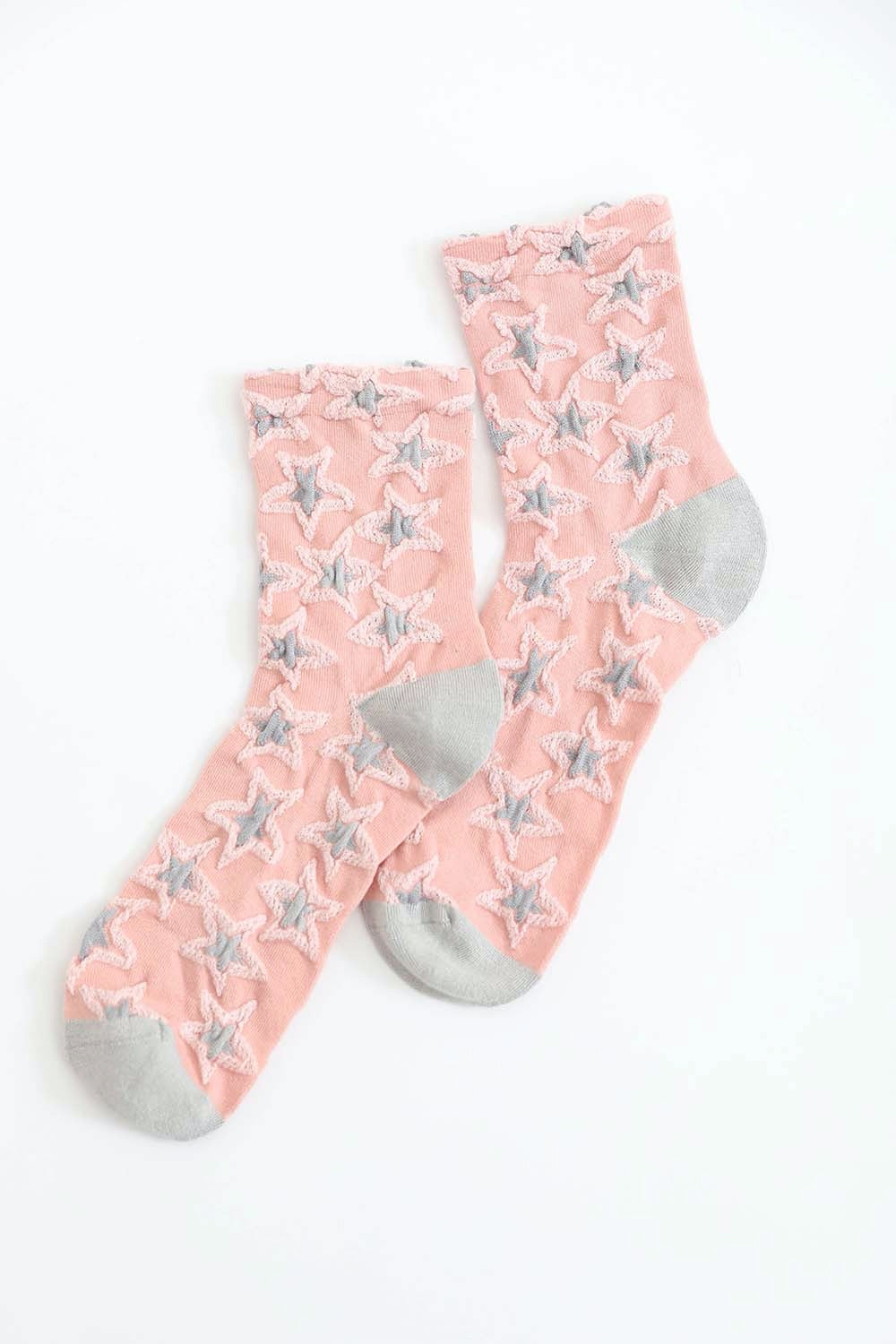 A pair of eco-friendly socks featuring a playful star design, showcasing their soft texture and vibrant colors.