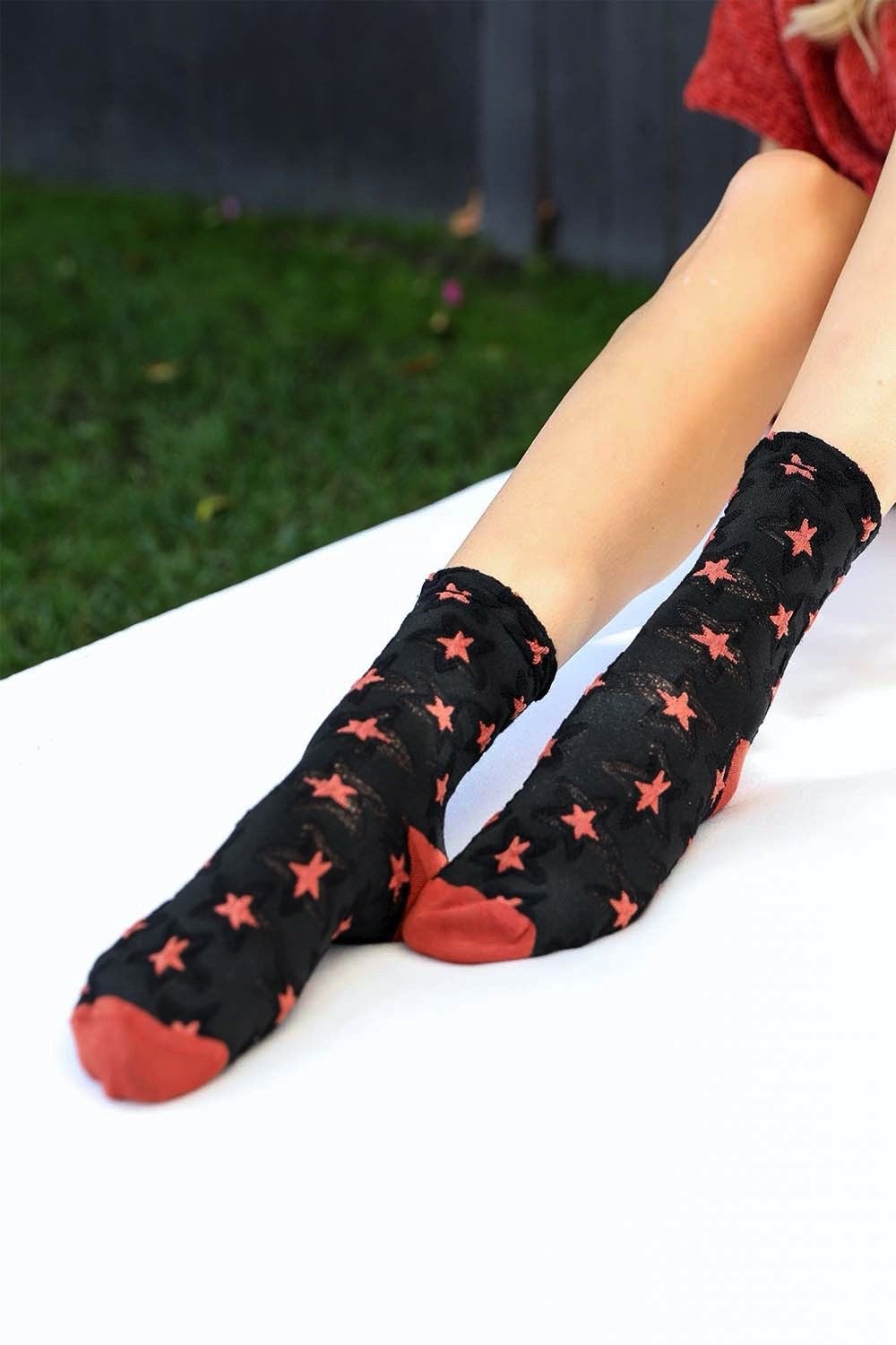 A pair of eco-friendly socks featuring a playful star design, showcasing their soft texture and vibrant colors.