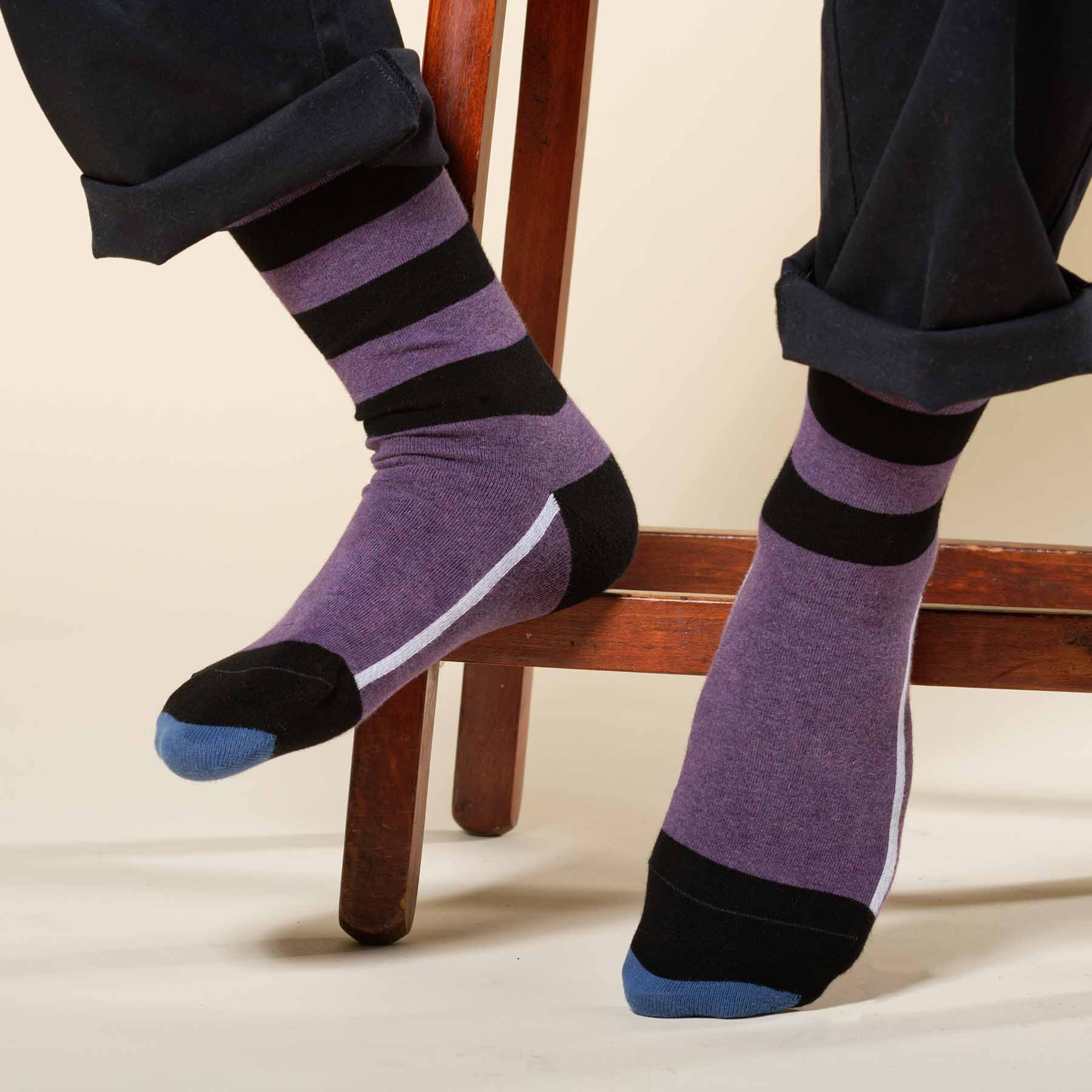 Equilibrium Organic Men's Socks in purple with black stripes and white line, showcasing sustainable fashion.