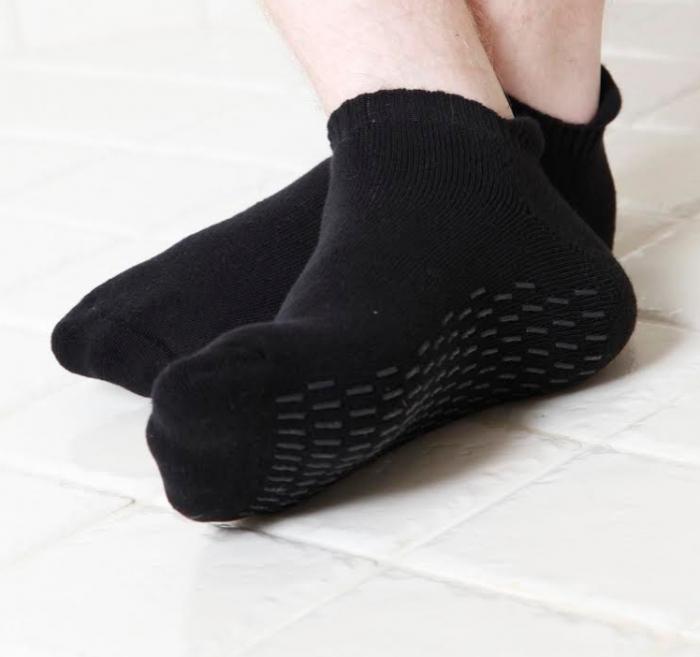 FINN men's black anti-slip socks featuring a soft cotton blend and textured grips on the soles for enhanced safety and comfort.