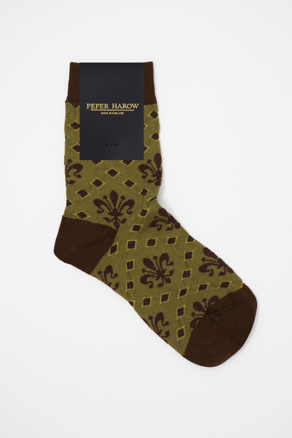 A pair of green Fleur De Lis women's socks made from luxurious Supima cotton, featuring an elegant design and seamless toe.