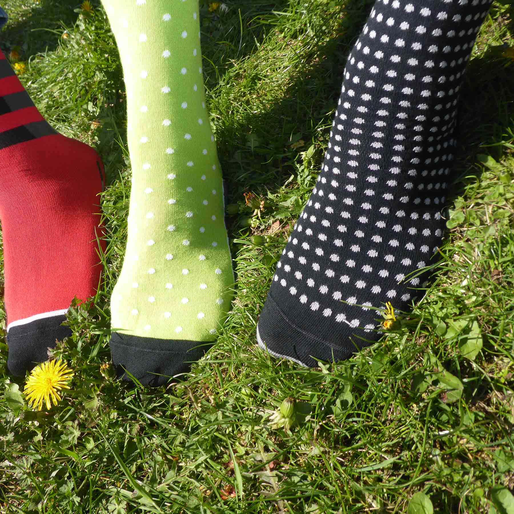 Grad Polka Men's Socks in black with grey, blue, and light grey polka dots, showcasing a stylish and luxurious design.