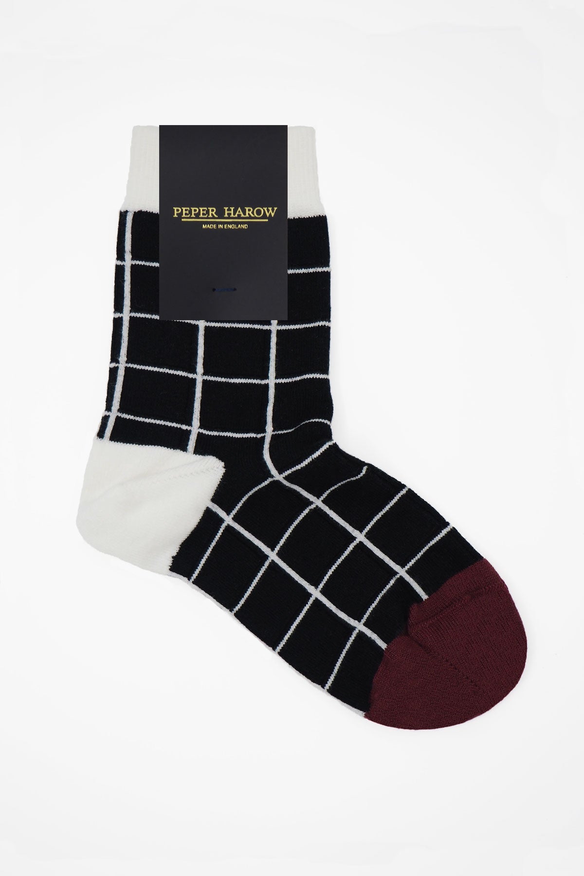 A pair of elegant black Grid Women's Socks featuring a symmetrical grid design, made from luxurious Supima cotton.