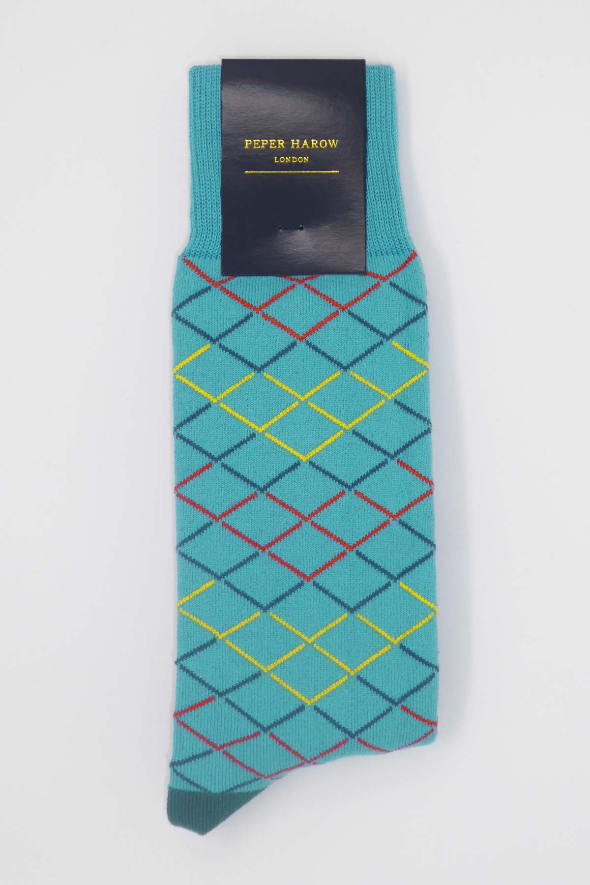 Hastings Men's Socks in Turquoise featuring a scale mail pattern with red, dark teal, and yellow colors, complemented by a sea green heel and toe.