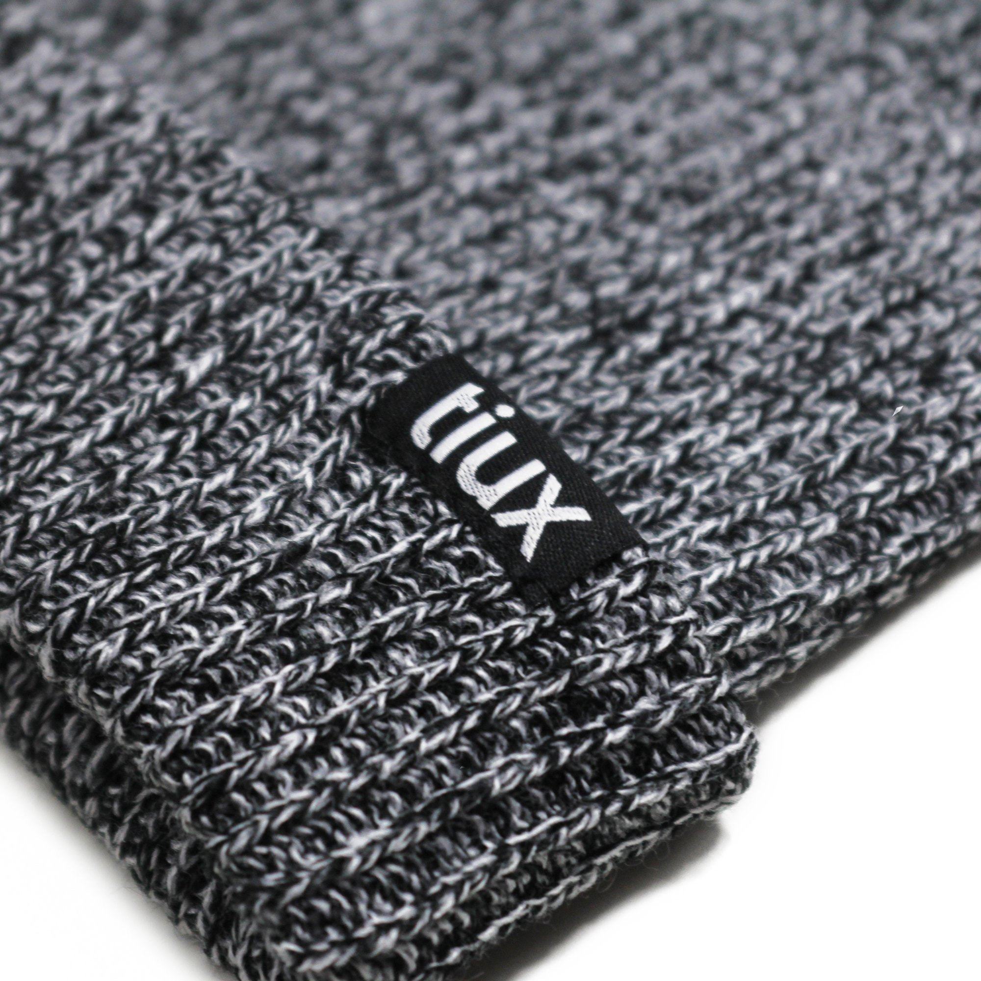 A stylish Heathered Beanie in various colors, showcasing its soft texture and versatile design for winter wear.