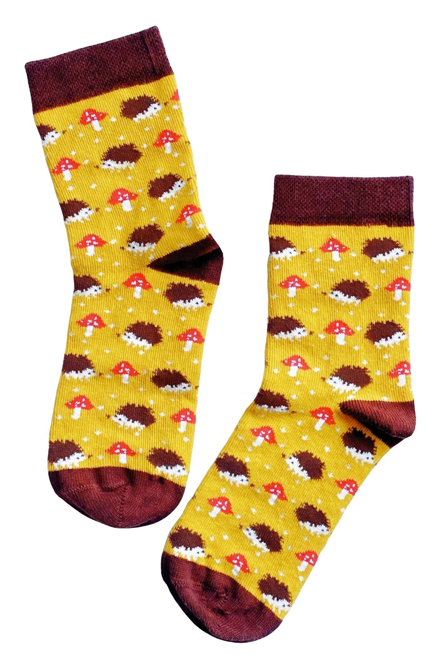 A pair of yellow cotton socks for children featuring a cute knitted hedgehog pattern, perfect for comfort and style.