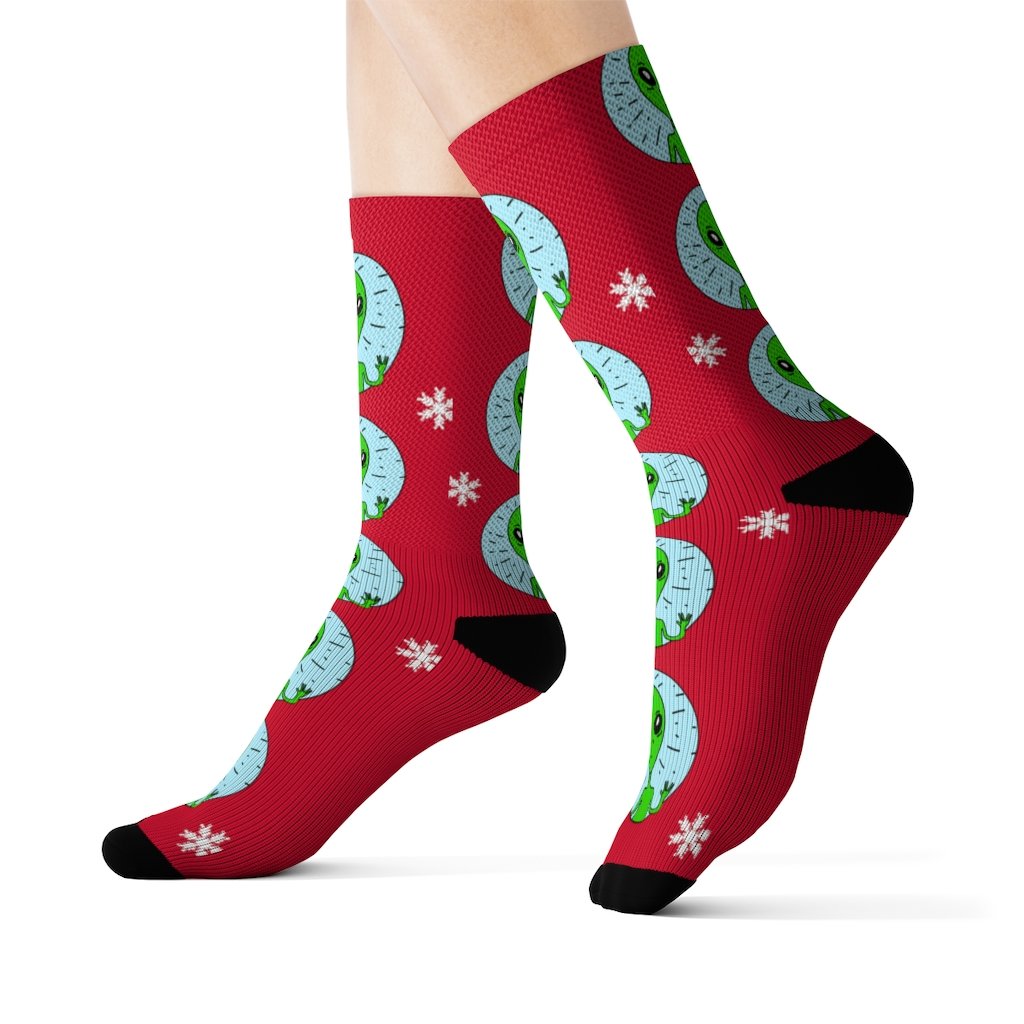 A pair of high-quality socks featuring a vibrant alien print, designed for comfort and style.