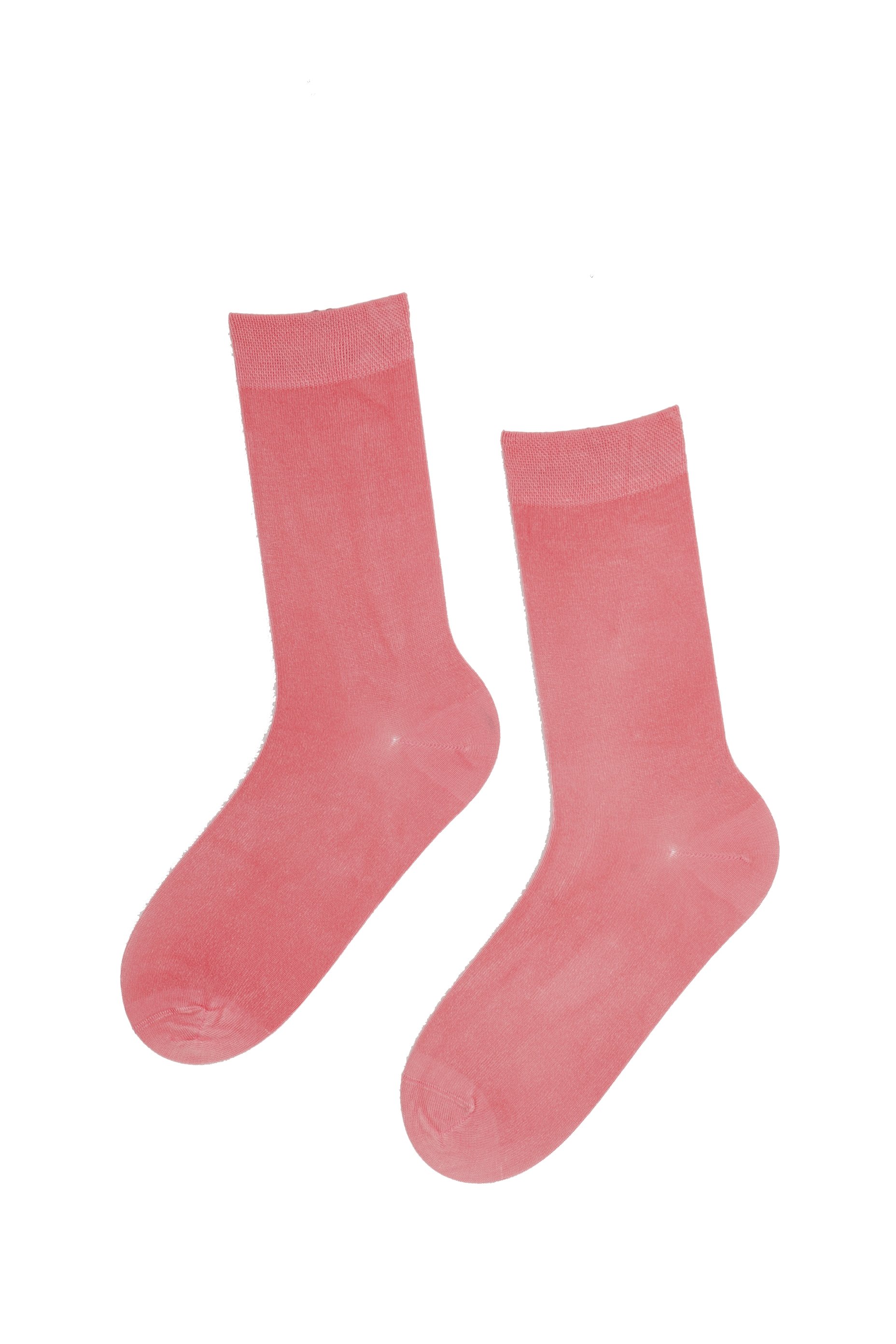 A pair of soft pink JANNE women's socks made from viscose yarn, showcasing their comfortable and stylish design.