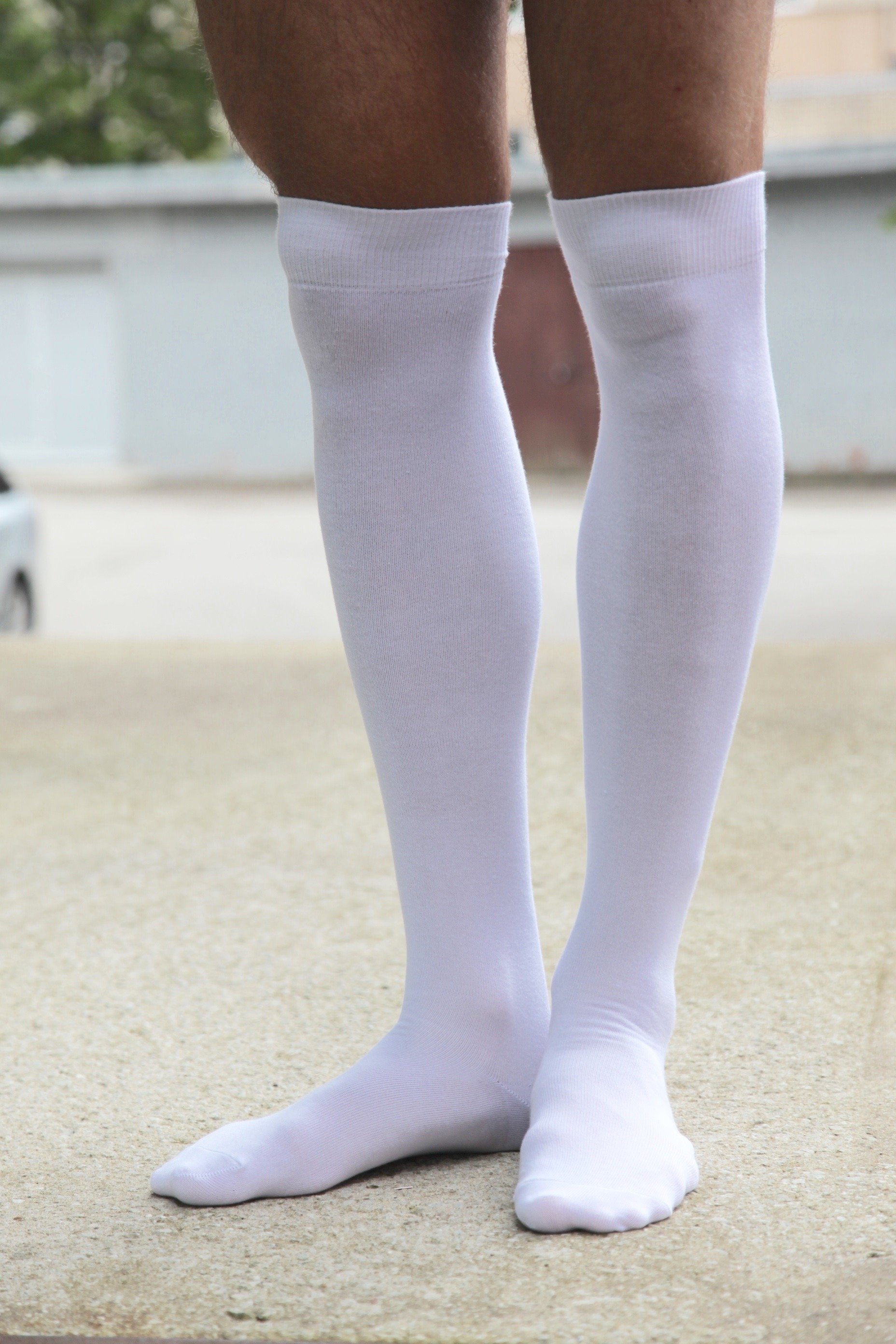 JESSI white over the knee highs, stylish and comfortable socks suitable for men and women, made from a soft cotton blend.