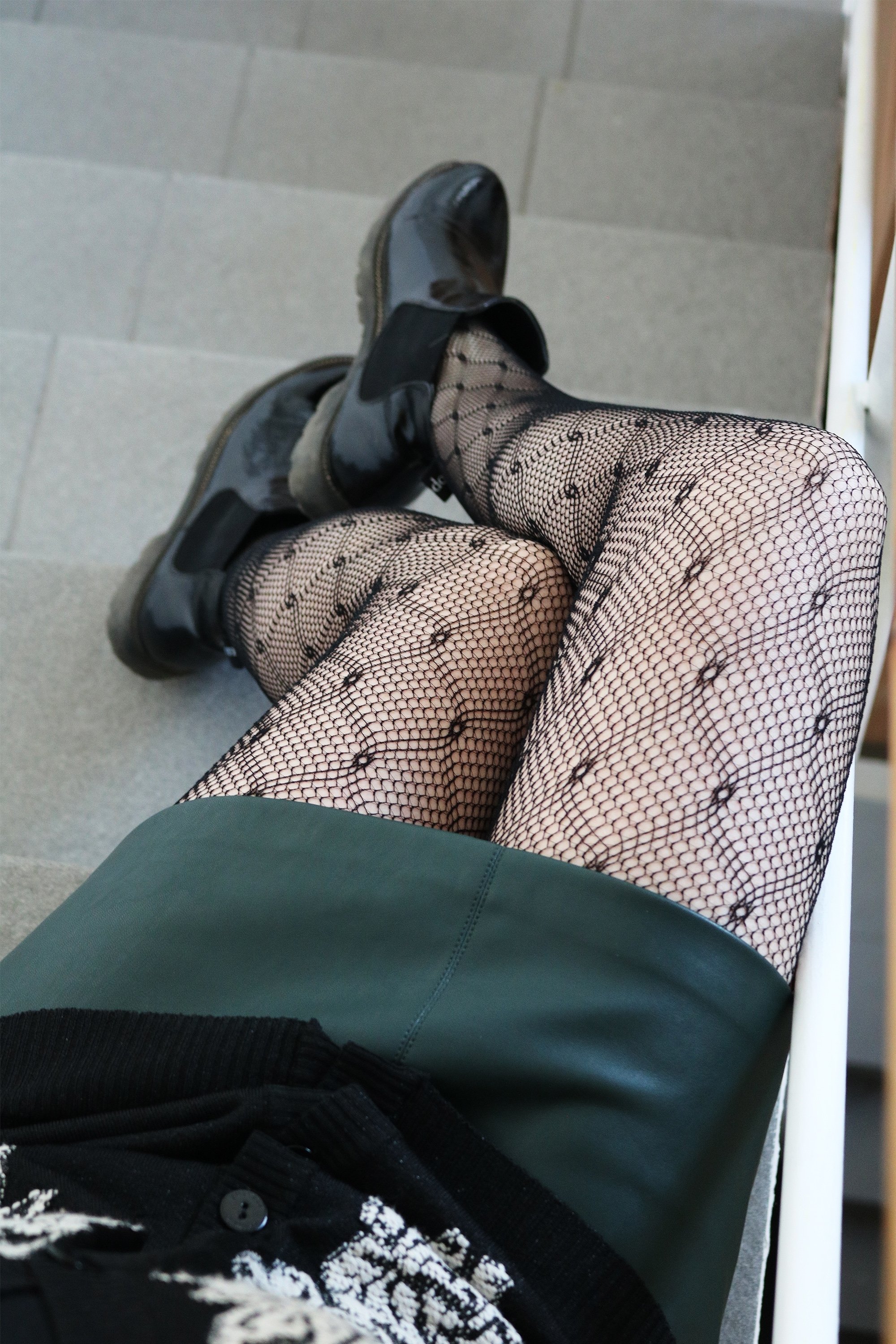 KAIJA black diamond patterned fishnet tights displayed elegantly, showcasing their stylish design and texture.