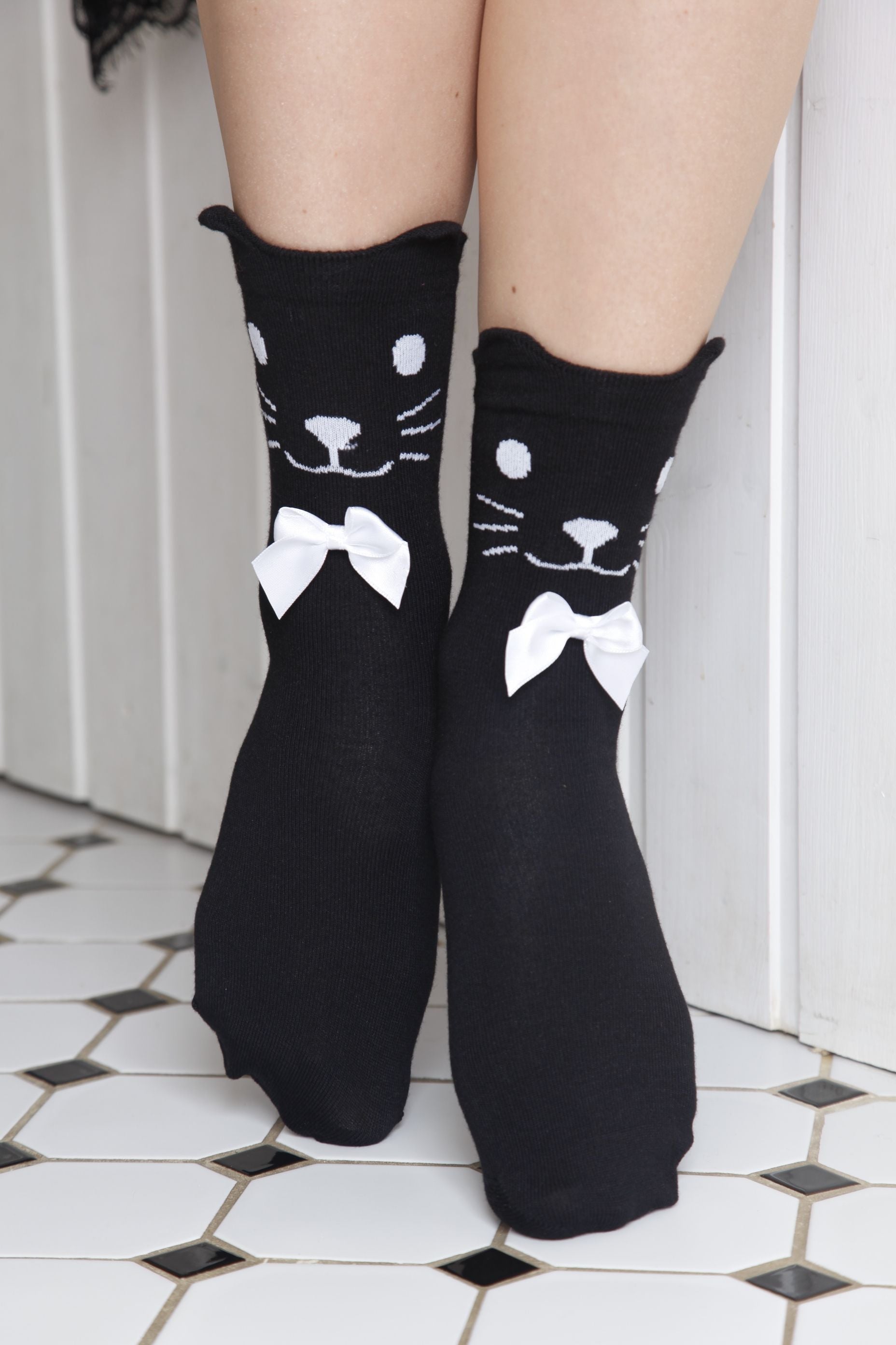 KITKAT women's socks featuring a cute cat design with ears and white satin bows, made from soft viscose material in black color.