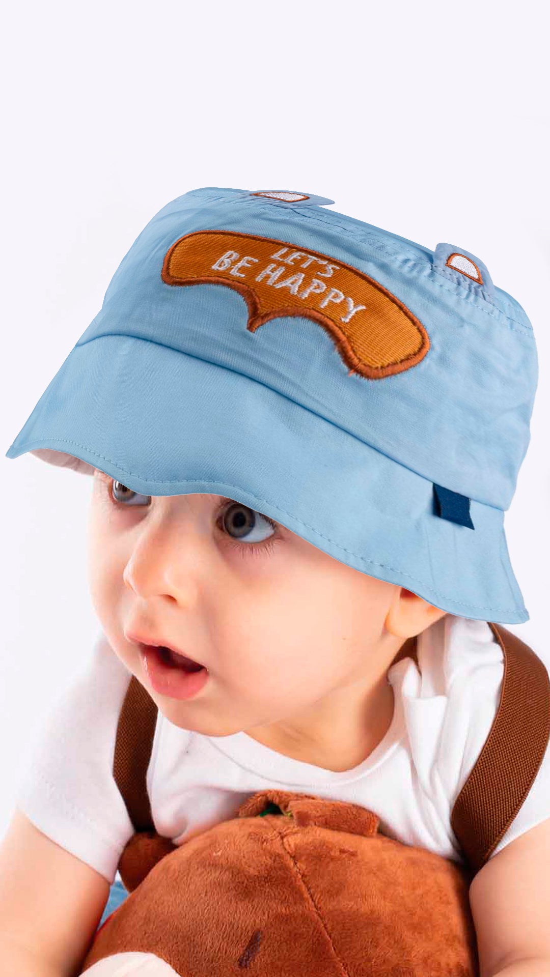 A white baby bucket hat with an adorable 'Let's Be Happy' appliqué, designed for children aged 1-3 years.