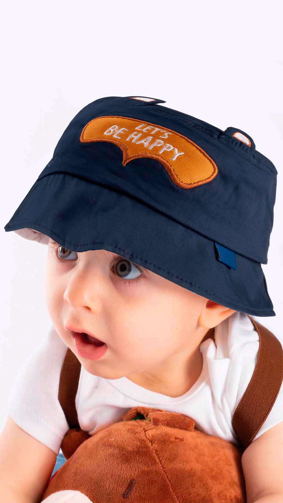 A white baby bucket hat with an adorable 'Let's Be Happy' appliqué, designed for children aged 1-3 years.