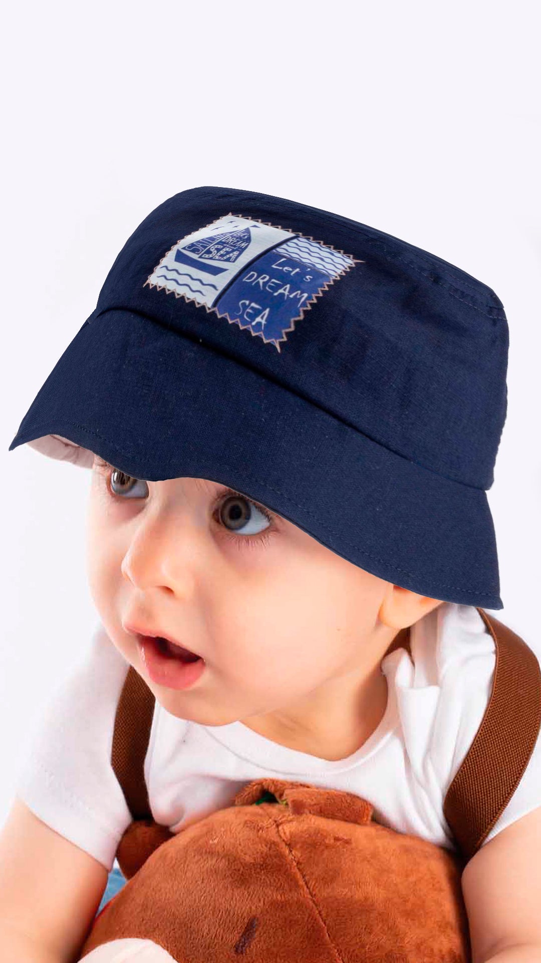 A stylish blue baby fedora hat with 'Let's Dream Sea' applique, designed for children aged 1-3 years, made from soft cotton and polyester blend.